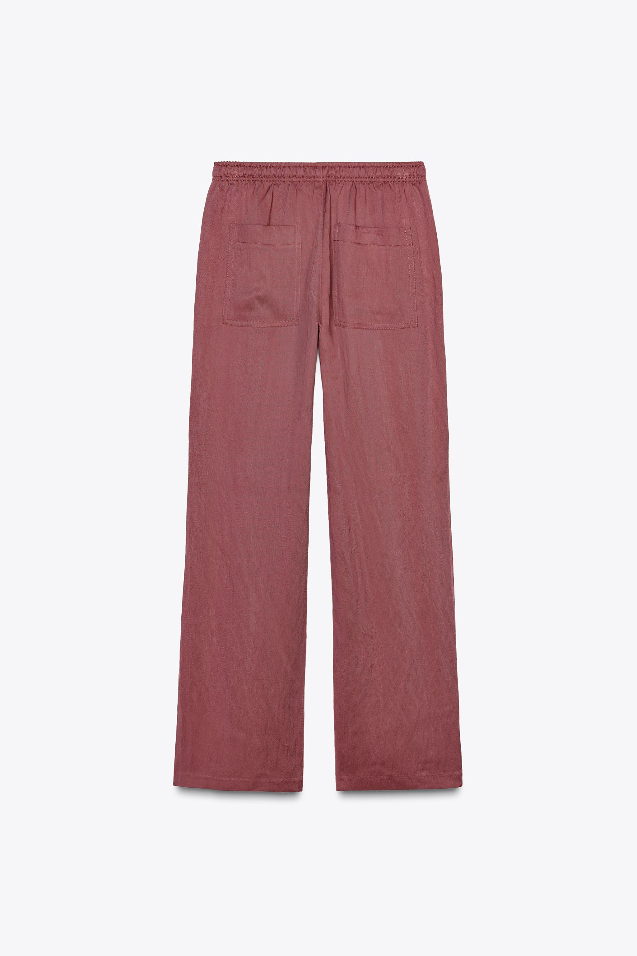 Mid-rise pants with elastic waistband and adjustable drawstring. Side pockets and back patch pock... | Zara US