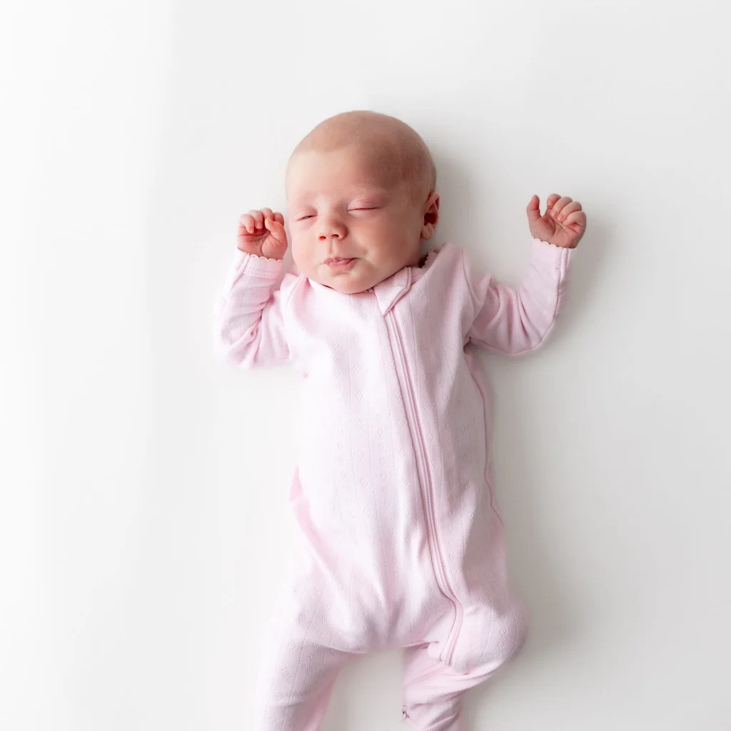 Pointelle Zippered Footie in Sakura | Kyte Baby