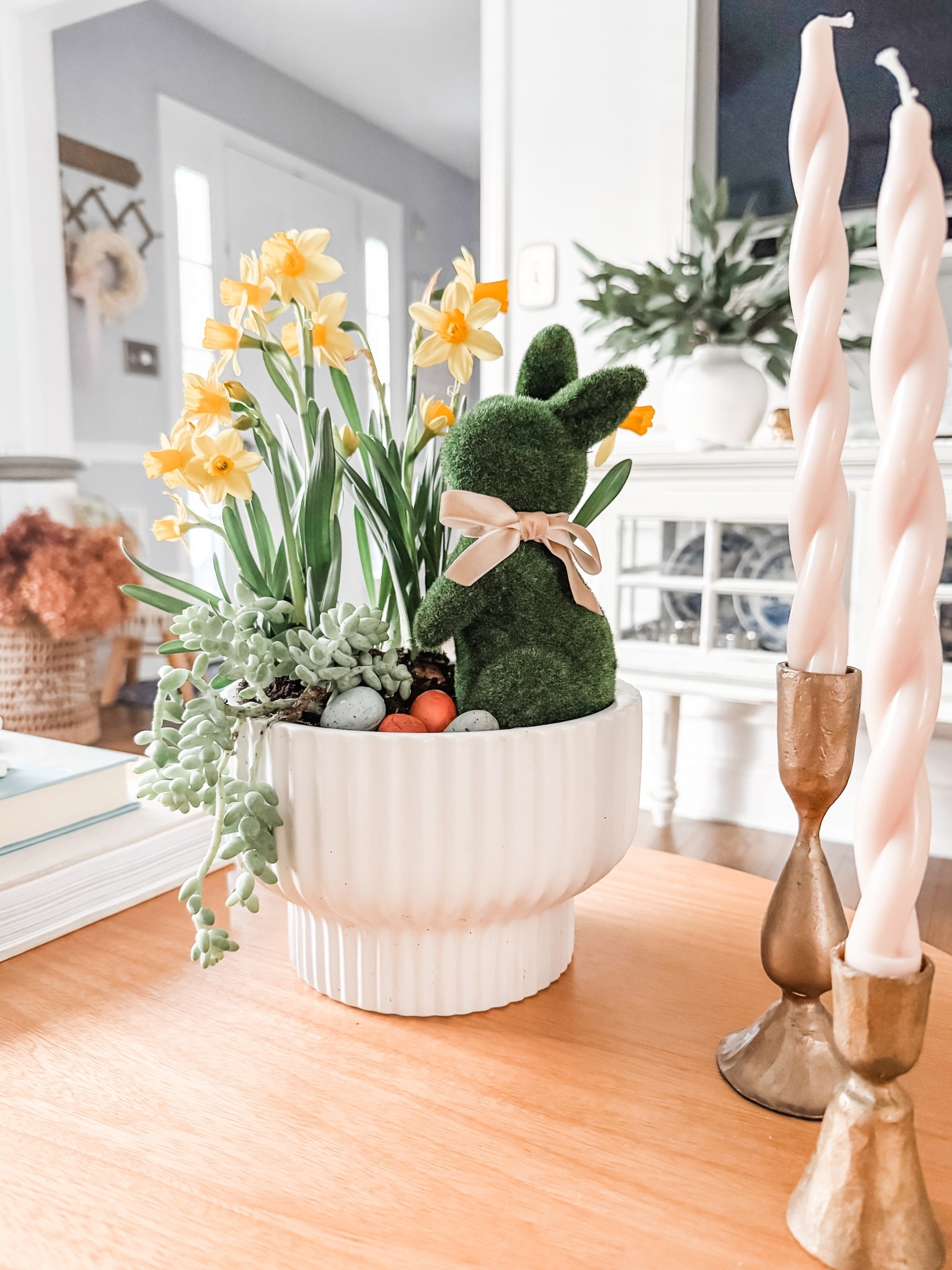 Spring indoor planter idea
Spring centerpiece
Coffee table decor
Spiral taper candles 
Pink taper candle
White fluted planter 
Flicked green bunny
Faux eggs
Console table decor
Gold candle holders
Artificial eucalyptus stems


#LTKStyleTip #LTKSeasonal #LTKHome