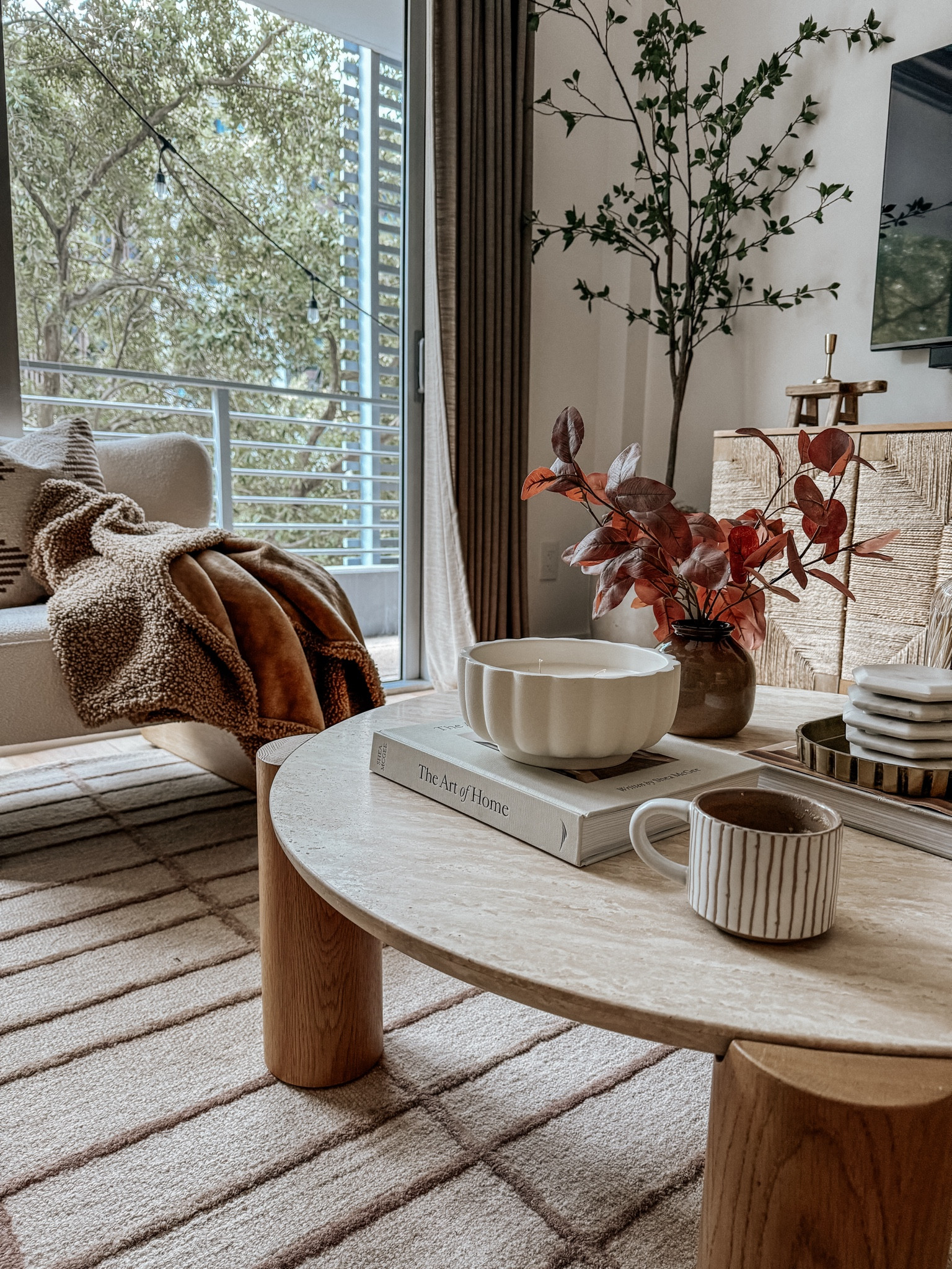 this is one of my favorite views! I love the layers of the coffee table, the decor on it, print of the rug, texture of the console table, green of the citrus tree and cozy throw blanket on the accent chair. When all the decorating details come together like this - it’s so rewarding! 



#LTKSeasonal #LTKHome #LTKStyleTip