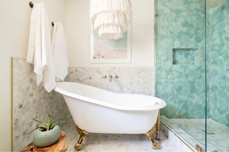 This is my daughters’ beachy bathroom with a claw foot tub, boho pendant and blue green shower tile.  The print ties in all the colors.  It’s a fun and playful bathroom.  #bathroomdecor #bathroomdesign #bathroomstyle

#LTKunder100 #LTKunder50 #LTKhome