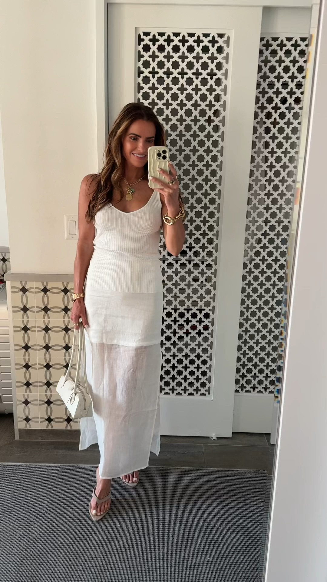 4th of july off to @trelunemontecito for italian wearing a monochromatic white #ootn♥️🤍🩵 wearing the perfect summer look my skirt comes in 3 colors is an updates version of your basic white maxi skit (also comes blk & brown too) 

runs tts i can wear both the size 2 & 4 (shown is the 2) 

chic, soft sweater twisted strap tank comes in several colors & runs tts im wearing a small 

fav must-have thongs & bag for summer too! 

#LTKStyleTip #LTKShoeCrush #LTKTravel