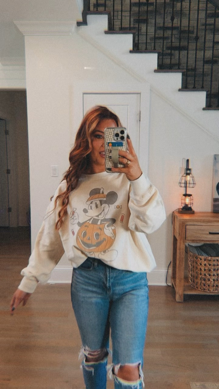 Ok she cute! I love the simplicity of this outfit & the subtle Halloween vibes! I’m in a size medium in the sweatshirt and size 6 regular in the jeans! I do have the ankles rolled! #americaneagle #halloweensweatshirt #disney 

#LTKFindsUnder50 #LTKFallSale #LTKStyleTip