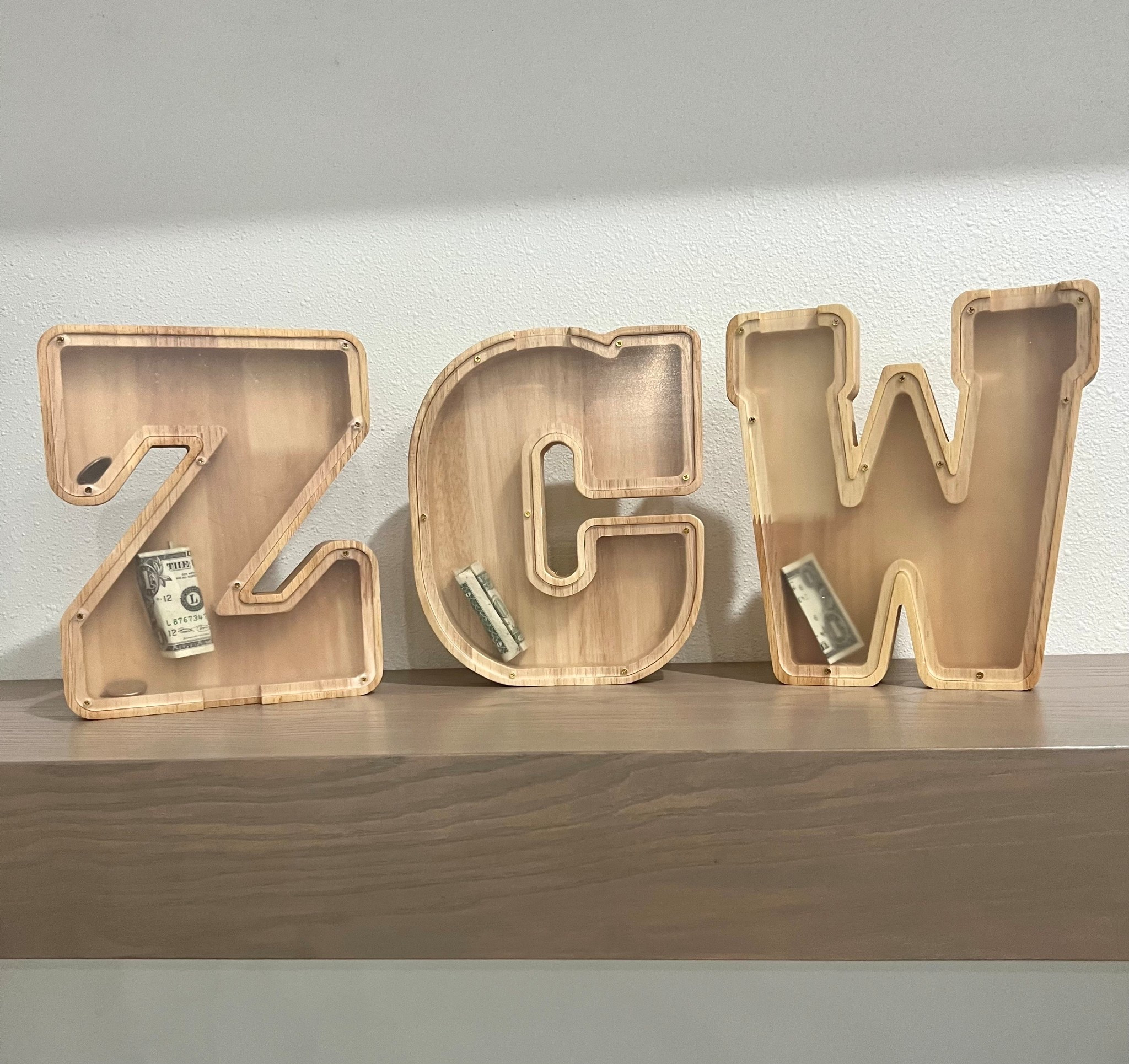 This is such a cute + meaningful way to save money 🤍
These personalized letter banks are perfect for goals, gifts, kids’ rooms, weddings, or starting a savings challenge.

✨ Custom letters
✨ Beautiful neutral wood
✨ Makes saving feel FUN and intentional
✨ Such a unique gift idea

I have them linked in my LTK + Amazon Storefront so you can grab your initials (or spell a word 👀)
👉 Tap the link & start saving the cute way

#AmazonFinds #AmazonMustHaves #HomeDecorFinds #GiftIdeas #SavingsChallenge #LTKfinds #NeutralHome #PersonalizedDecor #MoneyGoals #BudgetFriendly