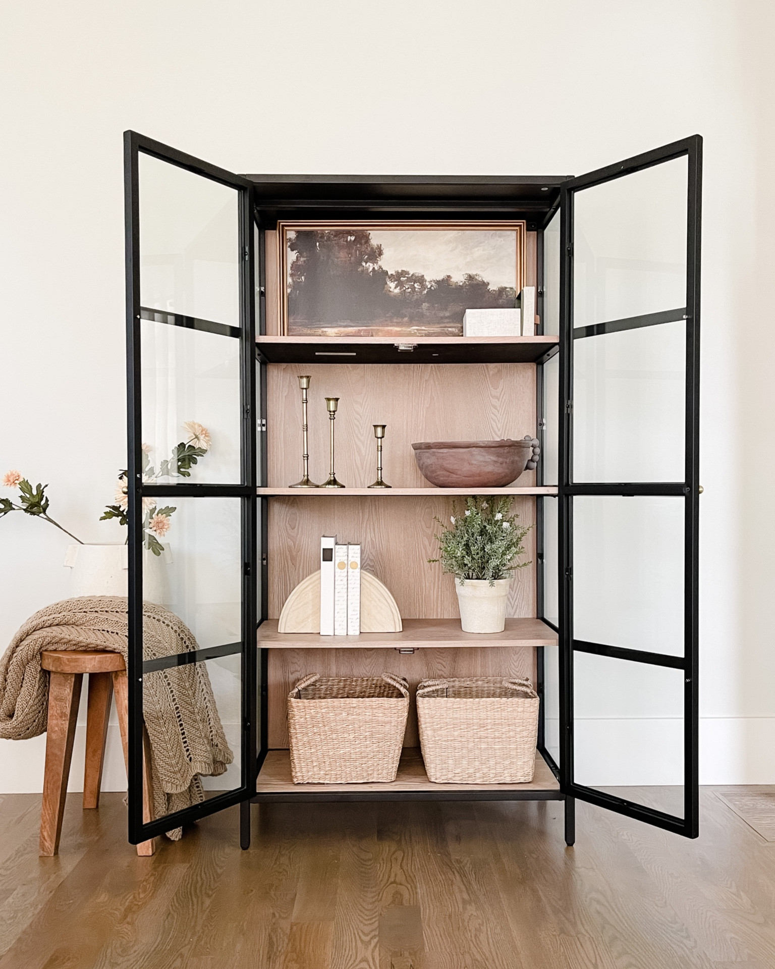 Spring cabinet decor. The best affordable black cabinet and neutral decor. Stool just restocked!

#LTKhome #LTKstyletip #LTKFind