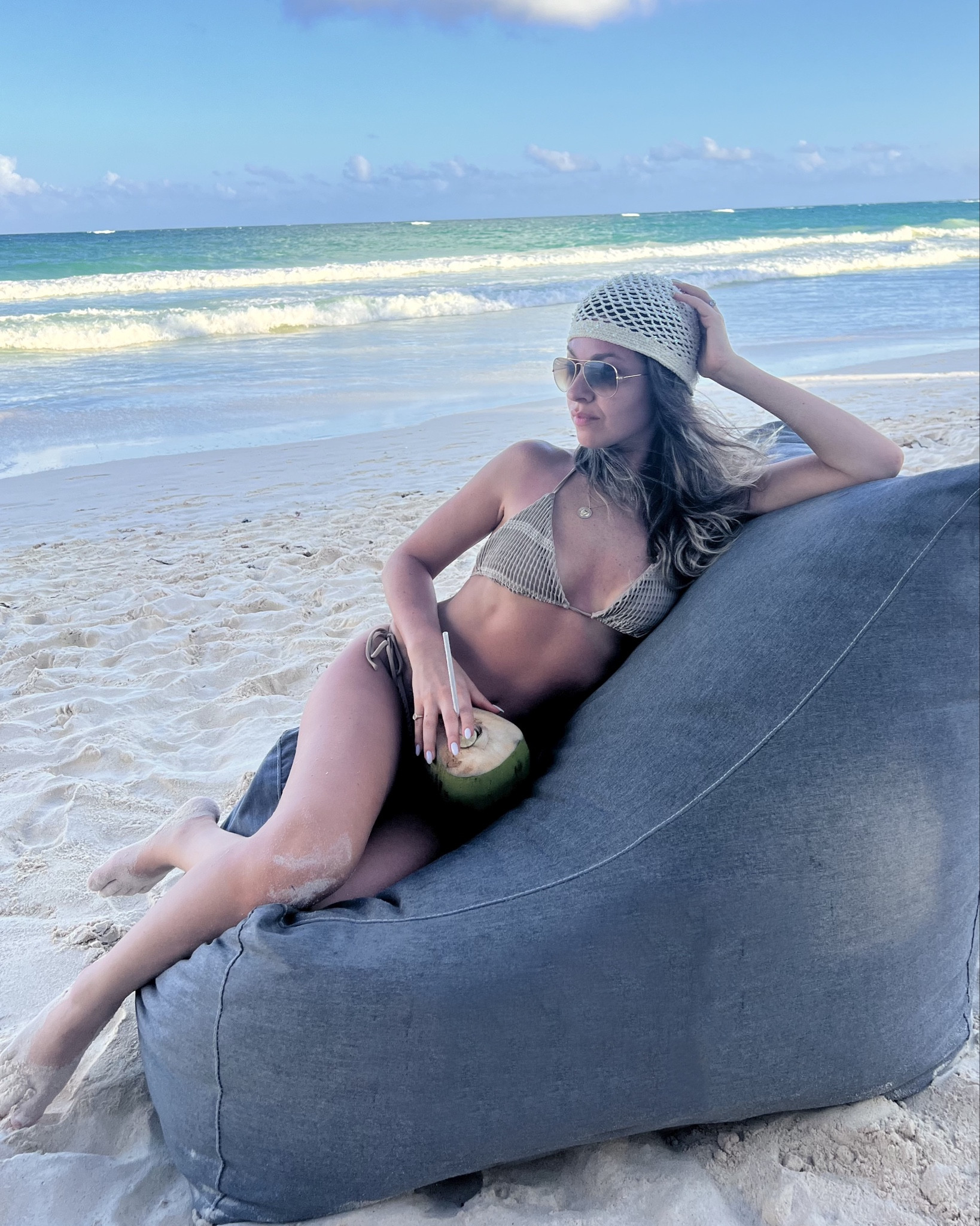Wearing my favorite bikini on vacation in Tulum Mexico 🫶🏼 this is the Tonie Bikini bottoms and Fifi bikini top by  PEIXOTO x Revolve in the color Tayrona Tan. 

I’m a petite 5’1”, wearing size s in the bikini top and a size xs in the bottoms

#LTKPetite #LTKSwim #LTKTravel