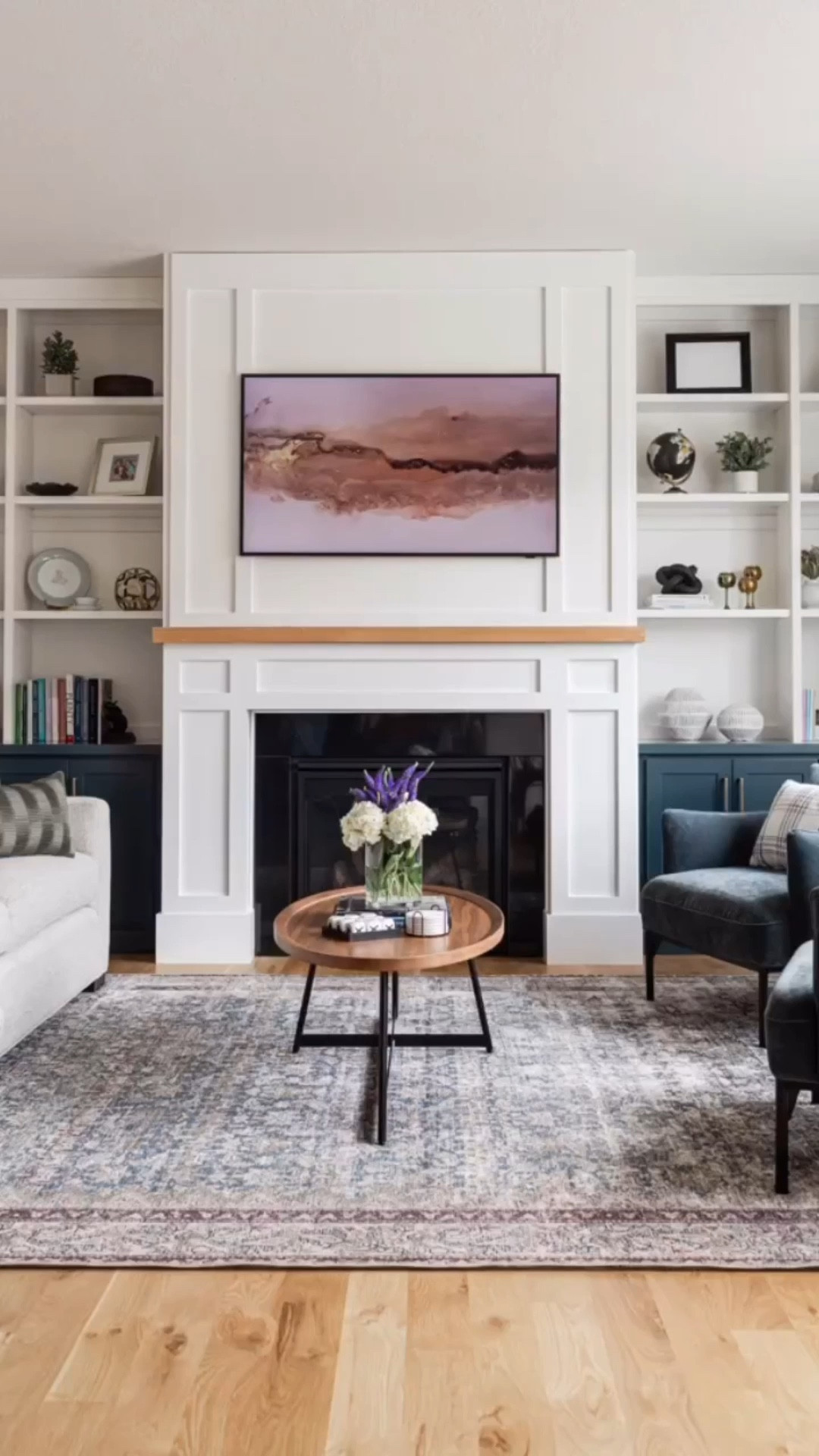 The tour of our IGH new build continues. We took this basic builder grade “greige” home from blah to wow. Shop this open concept living room and kitchen, which is grounded in neutrals with pops of color. // Living room area rug, neutral sofa, oval wood coffee table, home accents, matte black kitchen faucet, faux leather counter stools, bookshelf decor.

#LTKHome #LTKFindsUnder100 #LTKFindsUnder50