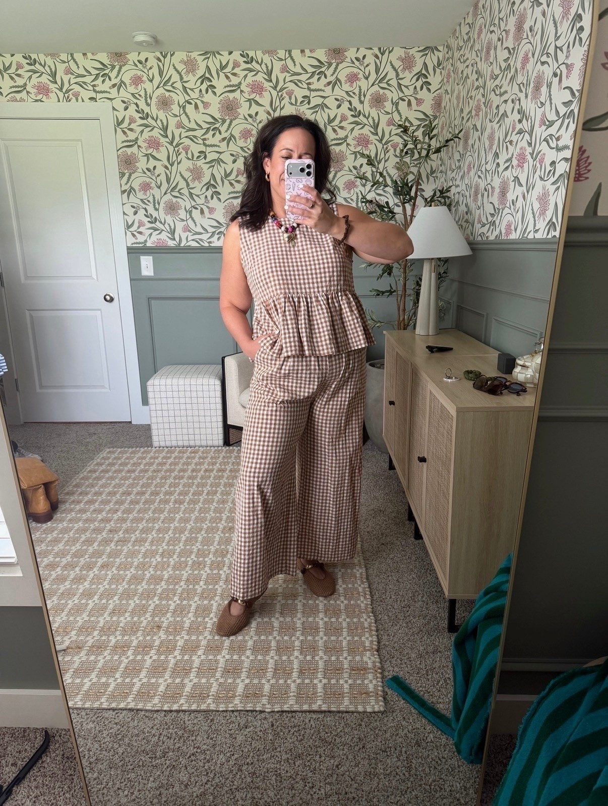 This gingham matching set makes getting dressed so easy while still looking put together. The peplum top and wide leg pants are such a cute combination for everyday wear, and it’s currently on sale. I love how comfortable and flattering this set is for running errands, lunch, or a casual day out.

#LTKSeasonal #LTKMidsize #LTKootd
