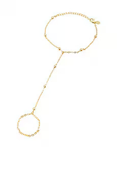 petit moments Sol Hand Chain Bracelet in Gold from Revolve.com | Revolve Clothing (Global)