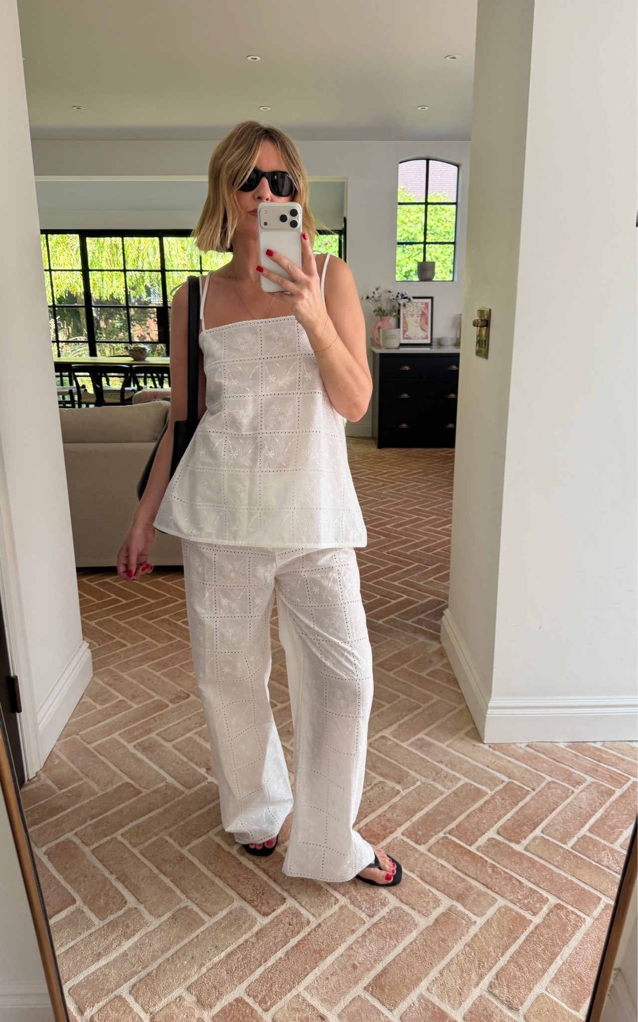 The perfect summer co-ord 🤍

white eyelet matching set, broderie anglaise set, white cami top, spaghetti strap top, white wide leg pants, embroidered cotton set, coordinated set, all white outfit, black slouchy tote, black flip flops, thong sandals, black sunglasses, layered gold jewelry, european summer, resort style

#LTKeurope #LTKsummer #LTKtravel