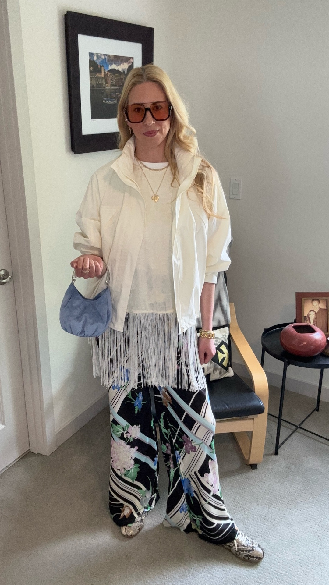 She’s easy and breezy, calm and confident, she makes it look effortless, she’s got her stuff together - the cool mom. At least I can dress the part for now 😂

Track jacket and white t-shirt @uniqlo
Fringe vest top @Anthropologie 
Pants @vrggrl
Shoes @h&m 
Bag @oldnavy
Sunnies @tiktokshop
Earrings @amazonstylefinds 
Tennis necklace @ebay
Chanel heart necklace @lavishrenewed 


#LTKootd #LTKOver40 #LTKmomlife
