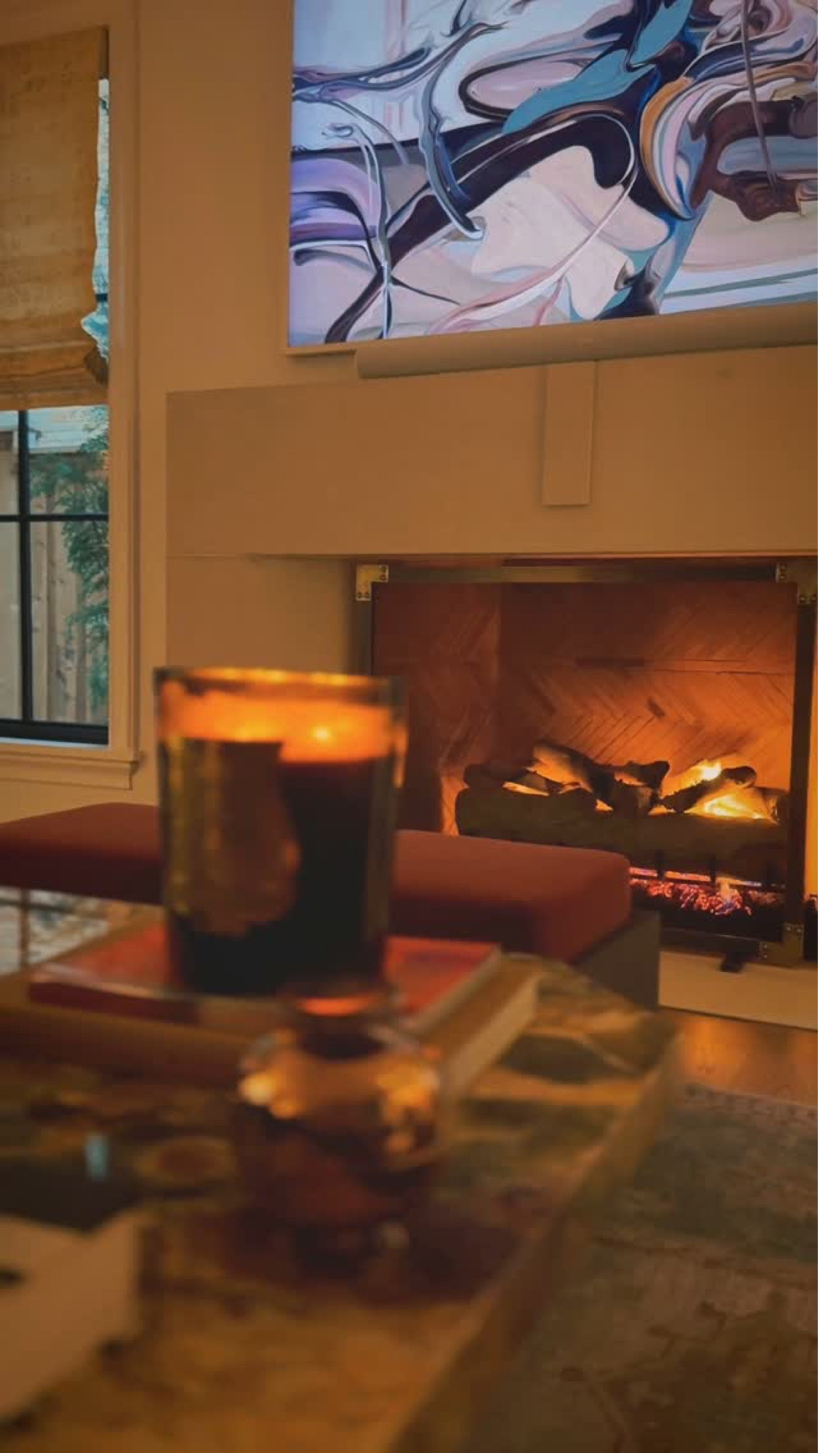 Current mood. Who’s with us? 🔥 ❄️ 🧊 🥶 ⁣
Mantle @dallaslimestonellc 
Window fabric @rosetarlowmelrosehouse 
TV @samsungtv 
Books @giopontiofficial @ralphlaurenhome 
Stools @rwguild Candle @trudon 🕯️ 
#livingroom #fireplacedecor #cozyvibes #texas #weather #cozyhome #dallas #ice #cozy #dallastexas #interiordesign #fireplace #snow #samsungframetv #samsung #trudon #candles #coffeetable