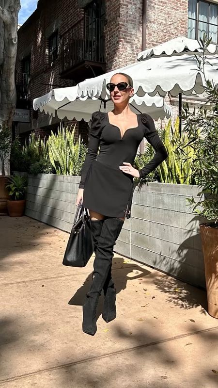 Fall outfit inspo with my fave new long sleeve black bodysuit a complete Fall wardrobe essential, black skort that looks like a black mini skirt. Black suede thigh high boots run a bit big so you might want to size down. Gold Versace Medusa pin would make a great Christmas gift for her.

#LTKstyletip #LTKunder100 #LTKshoecrush