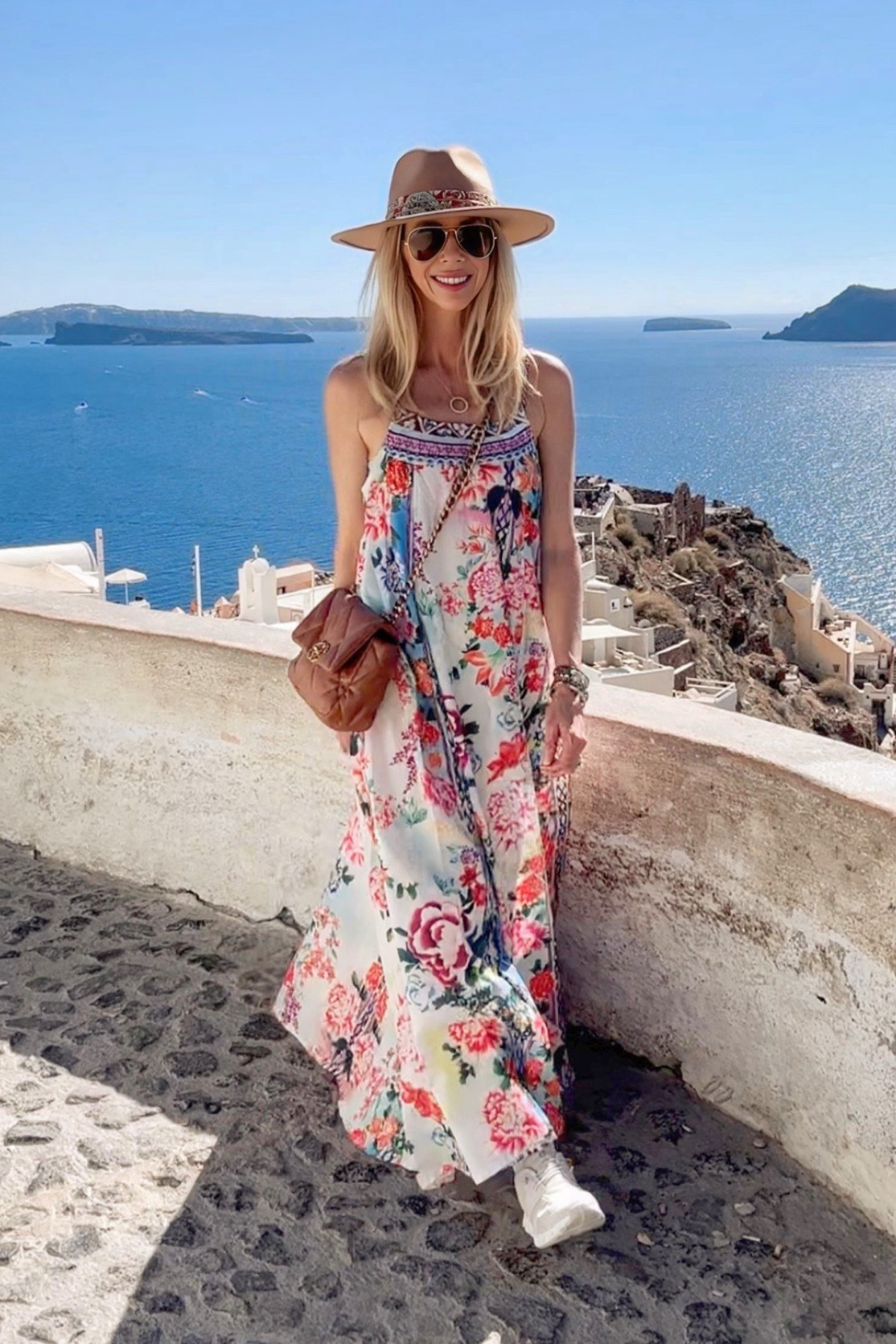 This flowing bohemian dress was perfect for traveling and very comfortable and cool. The on clouds sneakers are my favorite go to shoe and the Chanel bag is a closet staple. Ray bans are practical and another staple piece. Hat was great and fashionable 

#LTKCyberWeek #LTKFindsUnder50 #LTKTravel