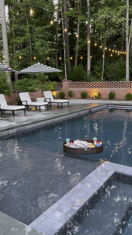 This floating snack tray was the perfect addition to our outdoor movie night at the pool! 

Chaise lounge, umbrella table, striped umbrella, projector screen, string lights

#LTKVideo #LTKSwim #LTKParties