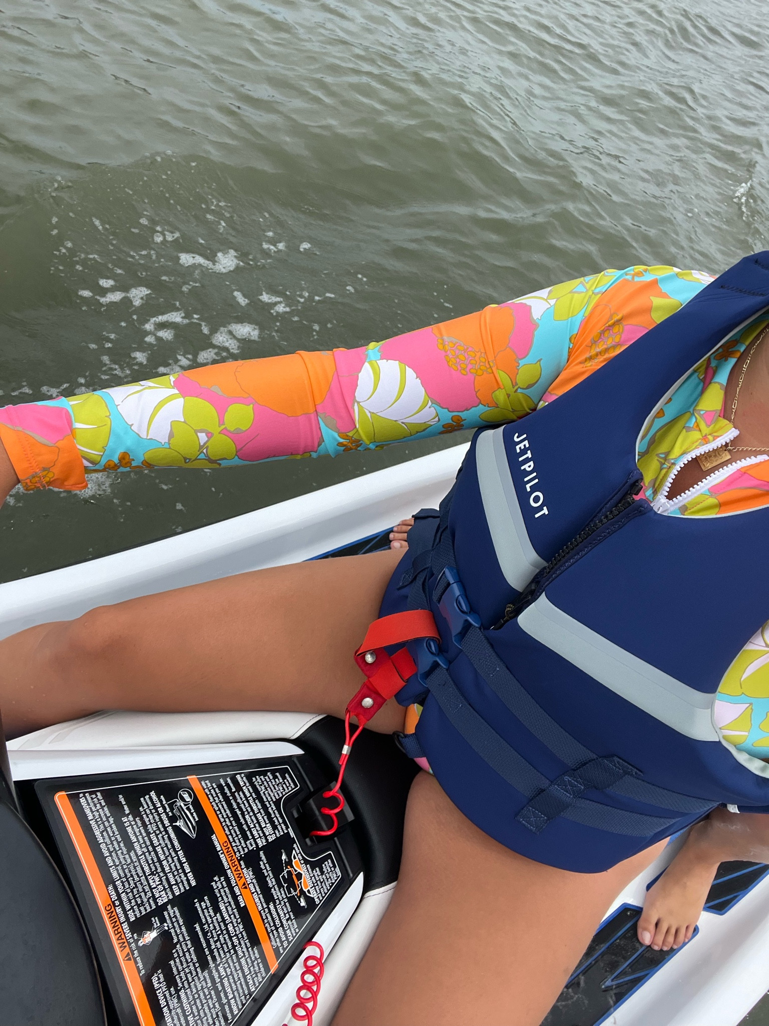 Navy jet pilot life vest for summer boating and jet skiing, jet ski must haves for summer, summer boating must haves,  coast guard approved life vest, Trina Turk surf and paddle rashguard one piece swimsuit for boating, boating swimsuits 

#LTKSeasonal #LTKActive #LTKSwim