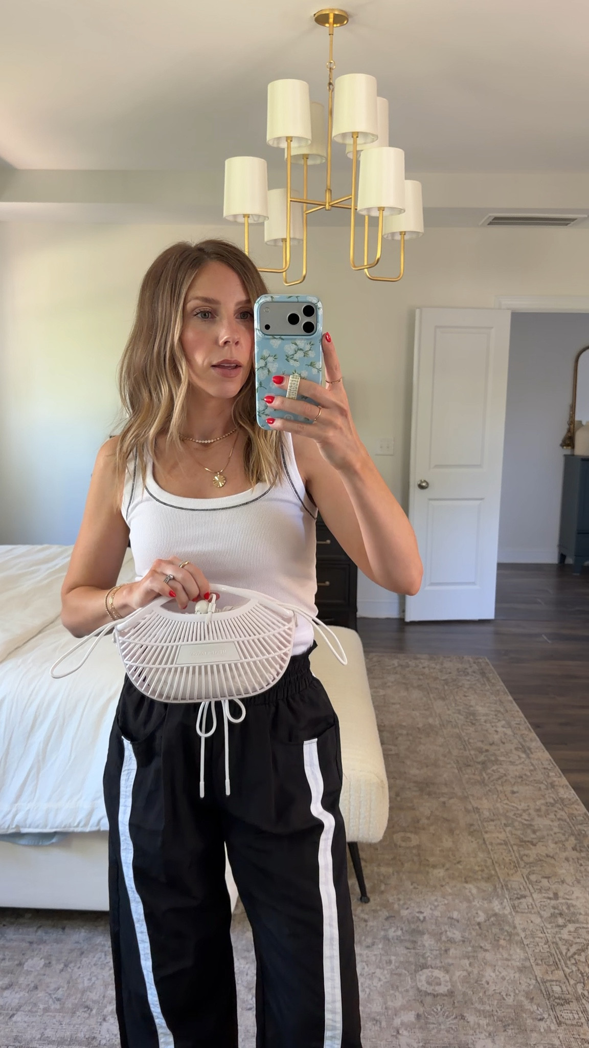 Save 20% on this tank and purse from Anthropologie with code LAURENB20  

 #LTKSaleAlert
