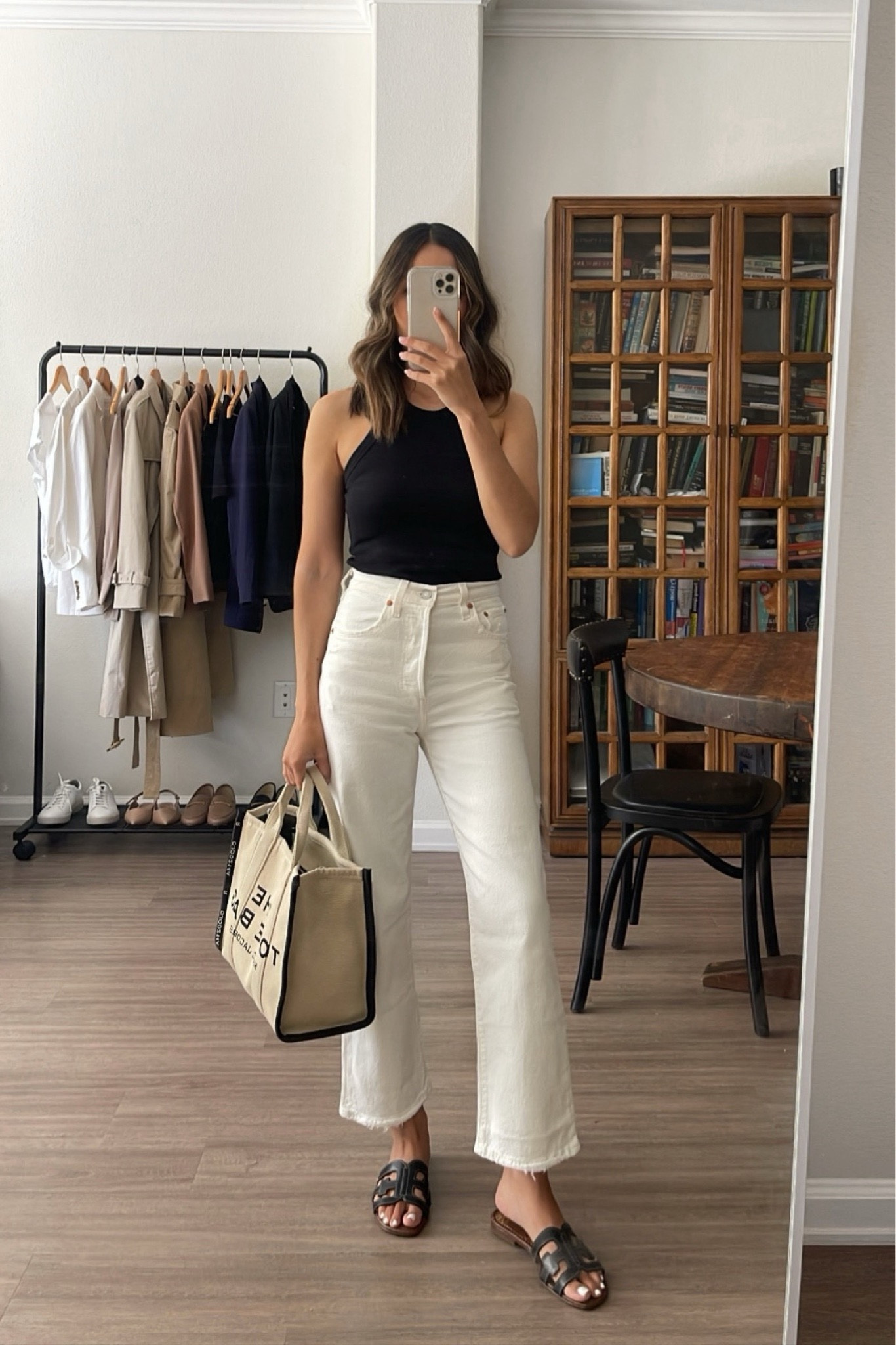 Minimal & elevated summer outfit styling white Levi’s jeans 

• ribcage straight ankle white jeans - tts, currently on sale (buy 2+, get 30% off applied at checkout // sale ends 7/24) 
• tank - xs 
• sandals - tts, some colors are currently on sale 
• Marc jacobs tote 

Linked to other similar styles 

#LTKStyleTip #LTKSeasonal #LTKSaleAlert