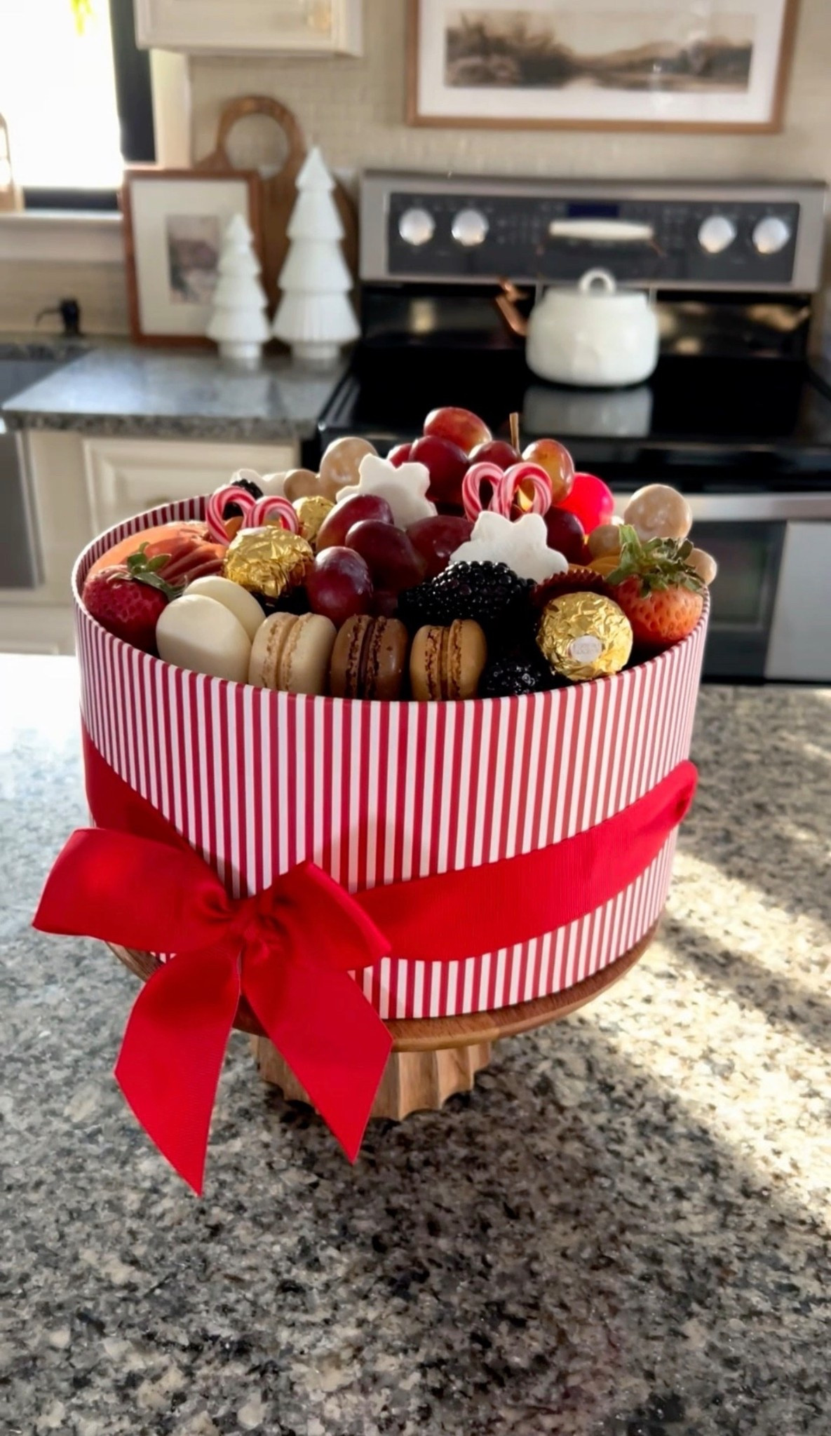Easy DIY Holiday Hostess Gift
This easy DIY holiday hostess gift is both beautiful and delicious. To make it, add snowflake marshmallows, grapes, strawberries, Ferrero Rocher chocolates, mini candy canes, gingerbread cookies, and salami to a round gift box. Top it with a festive ribbon for a simple, polished presentation.
#holidayhostessgift #charcuteriebox #holidaydessert #holidaycharcuterie #christmasideas

#LTKSeasonal #LTKHoliday #LTKGiftGuide

#LTKSeasonal #LTKGiftGuide #LTKHoliday