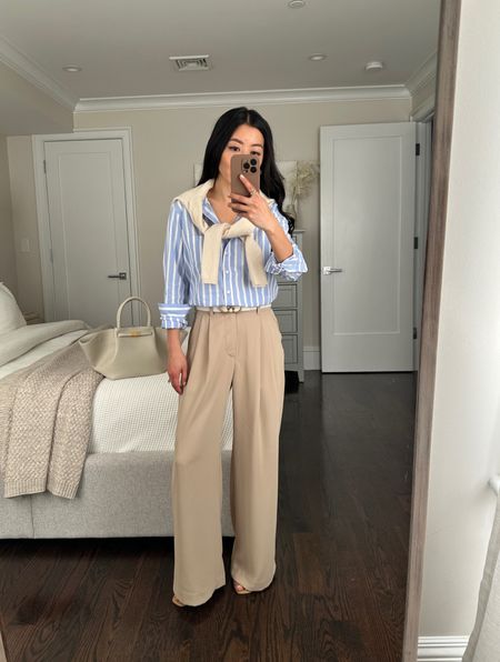 Wrinkle resistant pants on sale 
@gap #ad #howdoyouweargap

• High rise pleated trousers in tan 00 petite - these fit a little big on me, which is typical for Gap sizing 

00P measures 13" across the waist with stretch elastic back waistband, 11" rise, 27.5" inseam. loose fit through the hips and leg. I am 5 feet tall and wear these with a 2/2.5” heel. 

• Gap striped organic cotton shirt xxs petite true to size 

• demellier bag in cream 

• edited pieces belts xxs 

#LTKworkwear #LTKsalealert #LTKfindsunder100