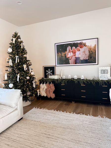So happy with how everything turned out! I am a little sad I won’t have a fireplace this year, but the console was fun to decorate! 
.
Living room Christmas decor Christmas tree countdown calendar 

#LTKHoliday #LTKSeasonal #LTKhome