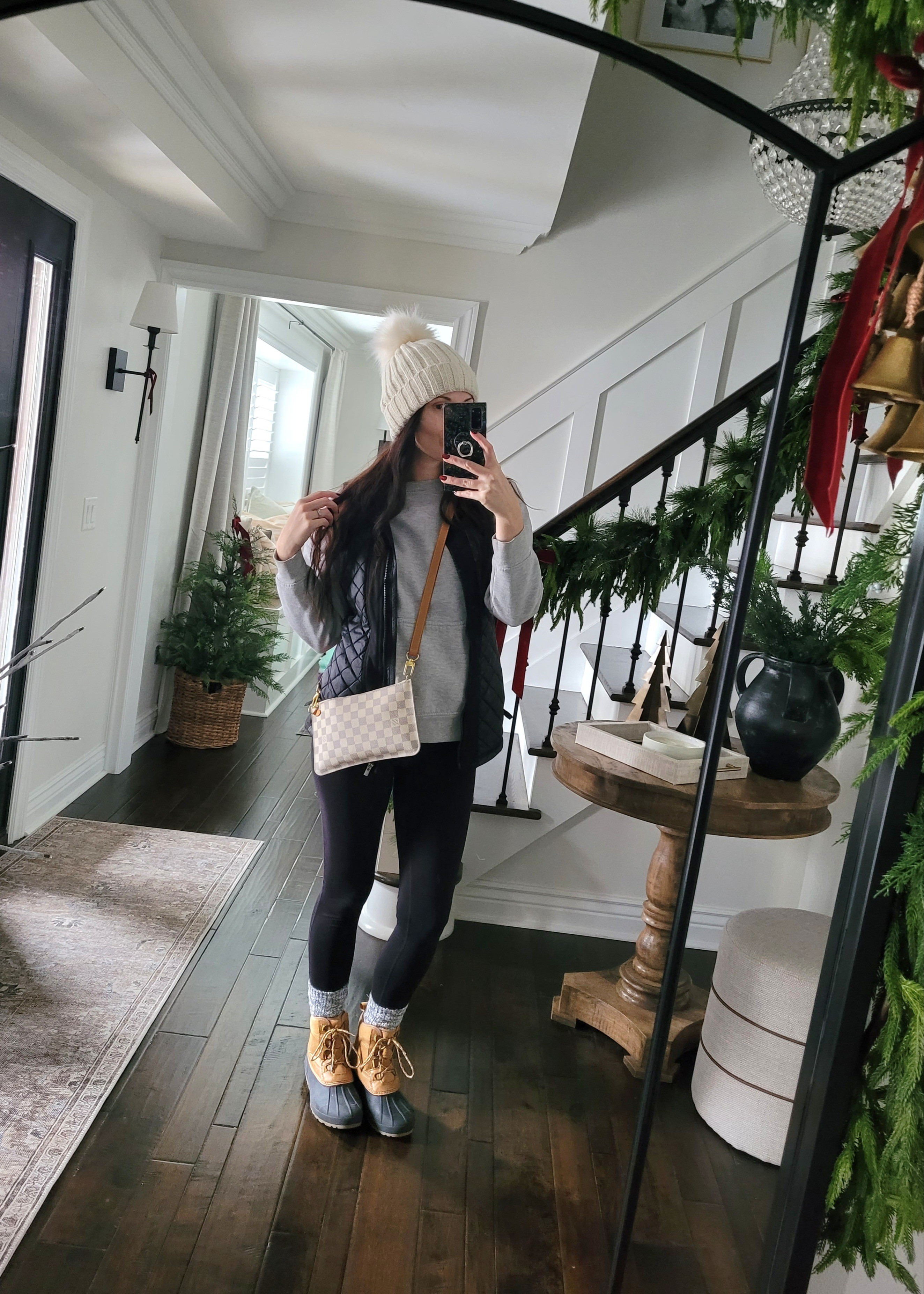 Winter outfit inspo with duck boots that are on Black Friday sale,  pom pom cable knit hat, puffer vest,  crewneck sweatshirt, boot socks,  and the best everyday black leggings!

#LTKCyberWeek #LTKActive #LTKSaleAlert