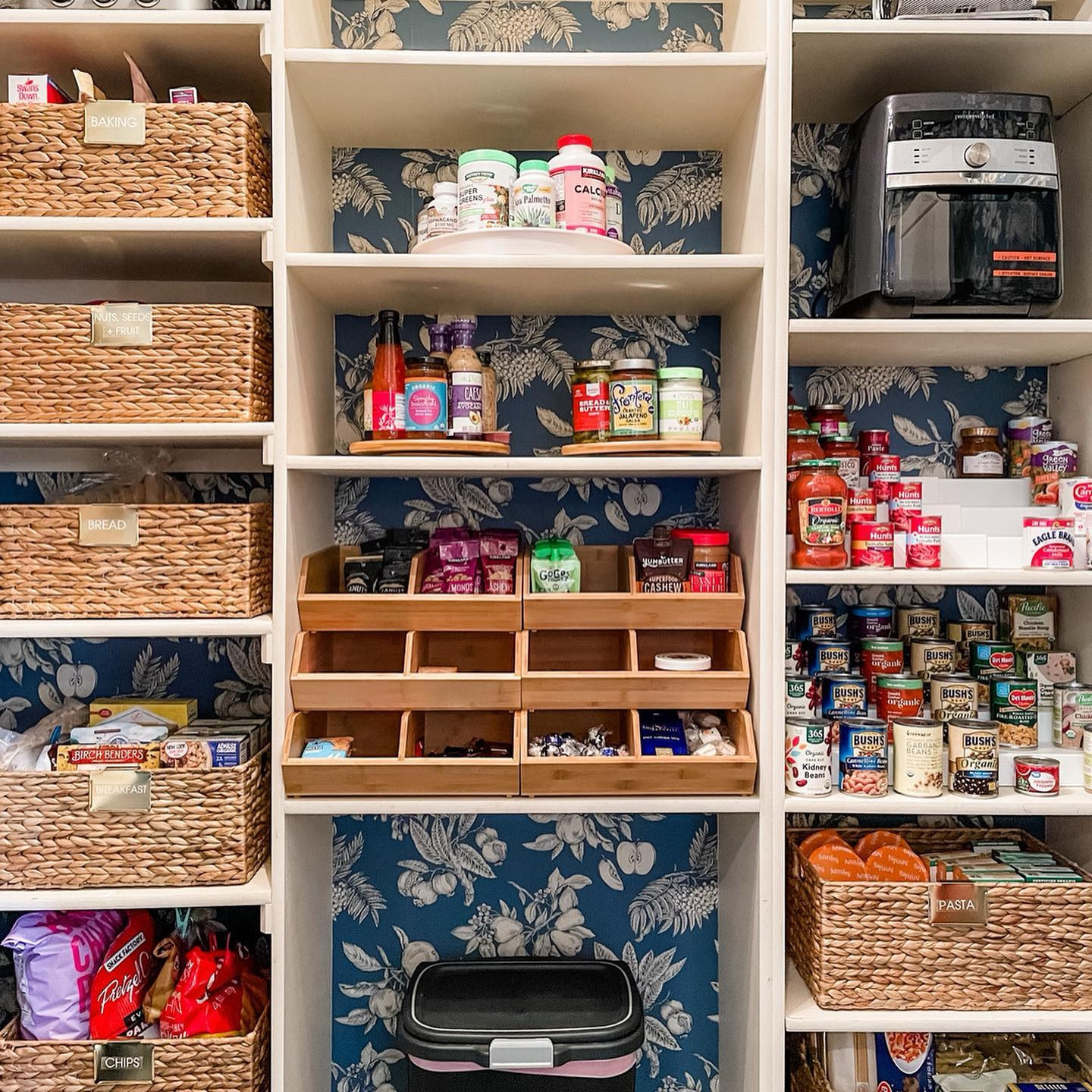 This client’s wallpaper made our pantry dreams come true! Add gorgeous (and functional) product into the mix...we now have a work of art!
•
If your pantry shelves are unable to be adjusted, it is important to find products that maximize every square inch, like these stackable bamboo bins. Product can make all the difference in the 🌎!