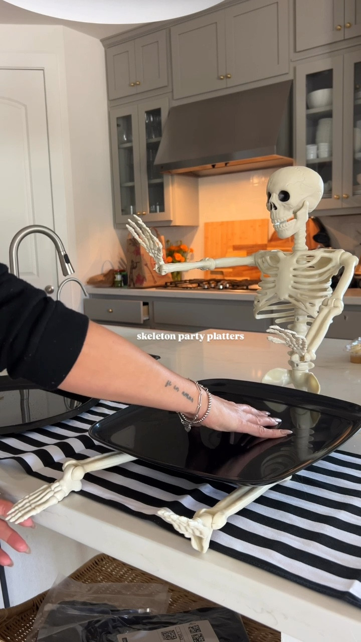 Easy, quick and cute spooky skeleton platters! A fun last minute touch for your Halloween trick-or-treating pre-game! All you need is a skeleton, plastic serving tray and some hot glue and there you have it! 🎃

#LTKParties #LTKHalloween #LTKHome