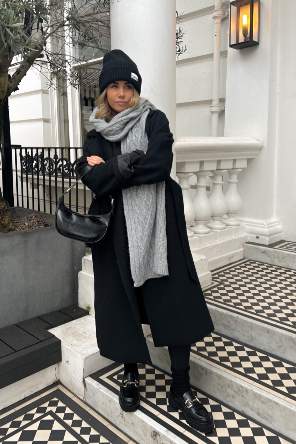 Cosy winter outfit for those extra chilly days when you just want to wrap up warm. Wearing ganni beanie with canle knit grey scarf, chunky loafers and a long wool black coat 

#LTKSeasonal #LTKeurope #LTKunder100