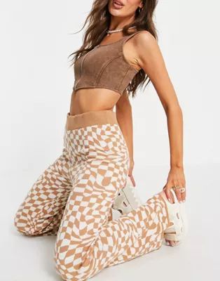 ASOS DESIGN co-ord knitted flare trouser in distorted check pattern in camel | ASOS (Global)