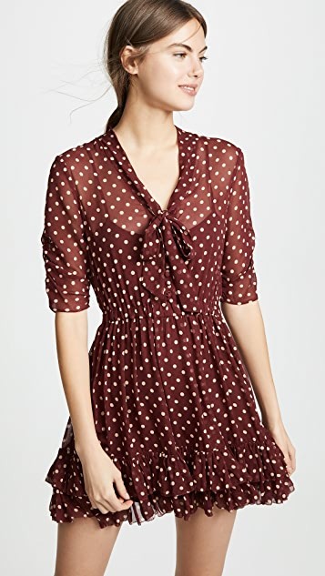 blue and white polka dot dress with red shoes