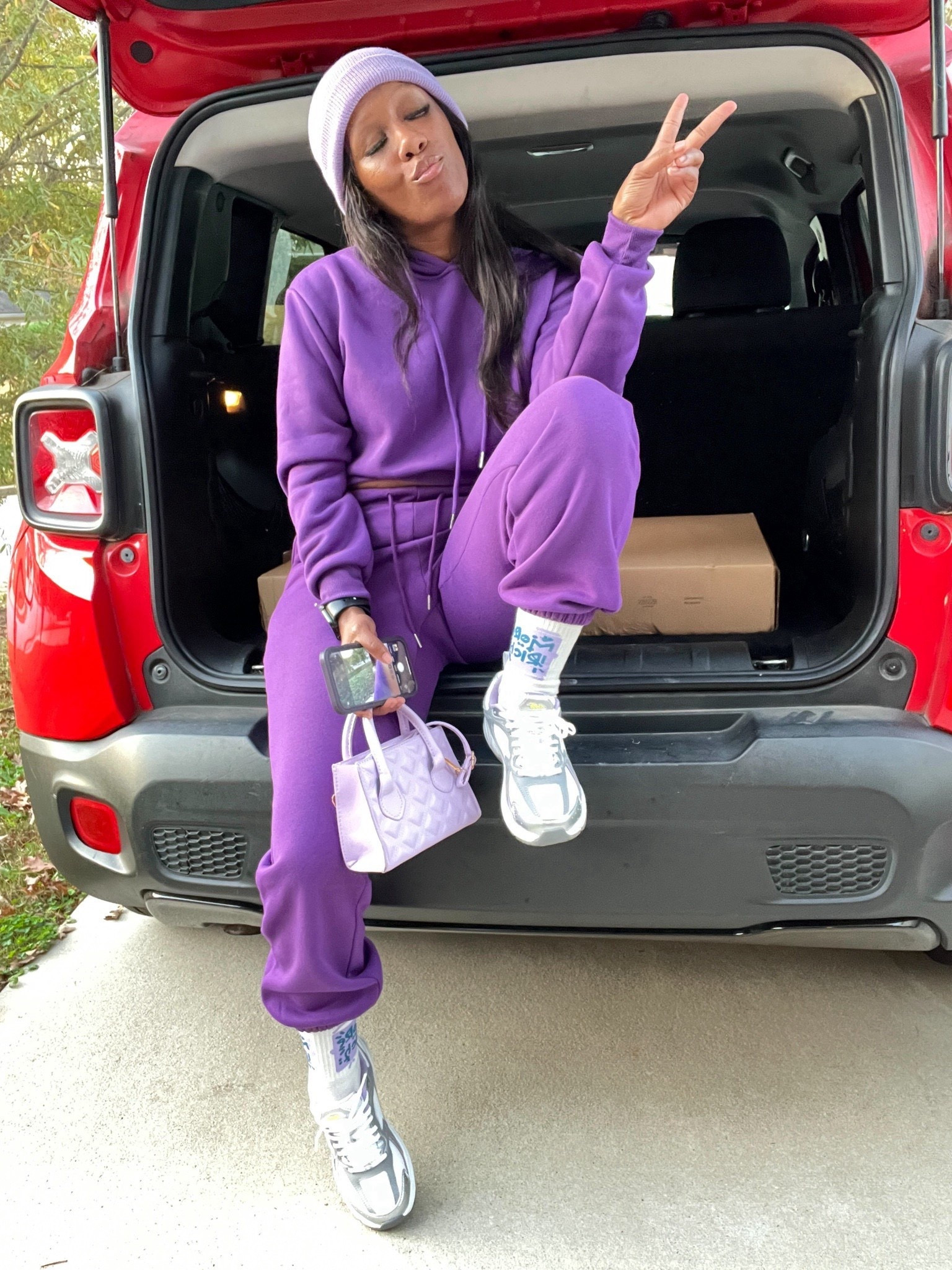 Purple sweatsuit, purple beanie, purple purse, and Avia 5000 sneakers
