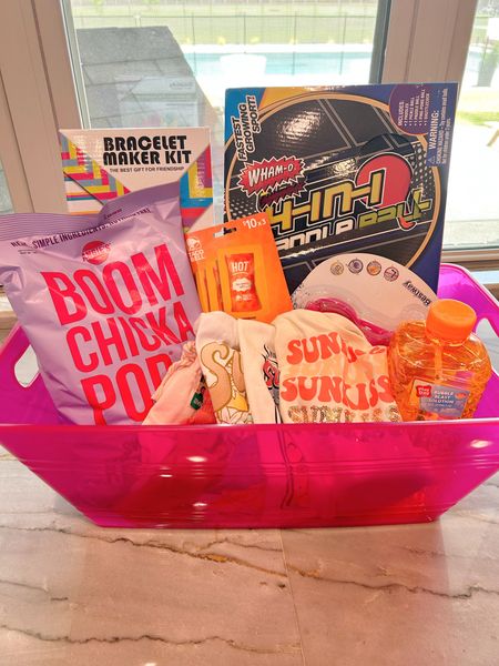 I put together a basket of fun for my daughter to take to my in-laws’ place this summer, as she will be spending quite a bit of time there. I filled it with gift cards to the movies and lunch spots, some of her favorite snacks, and some fun to help entertain her— paddle ball, friendship bracelets and bubbles— and added new clothes and goggles for swimming. 
Can’t wait to show her when she gets home from her last day of school! 

#LTKkids #LTKGiftGuide #LTKSeasonal