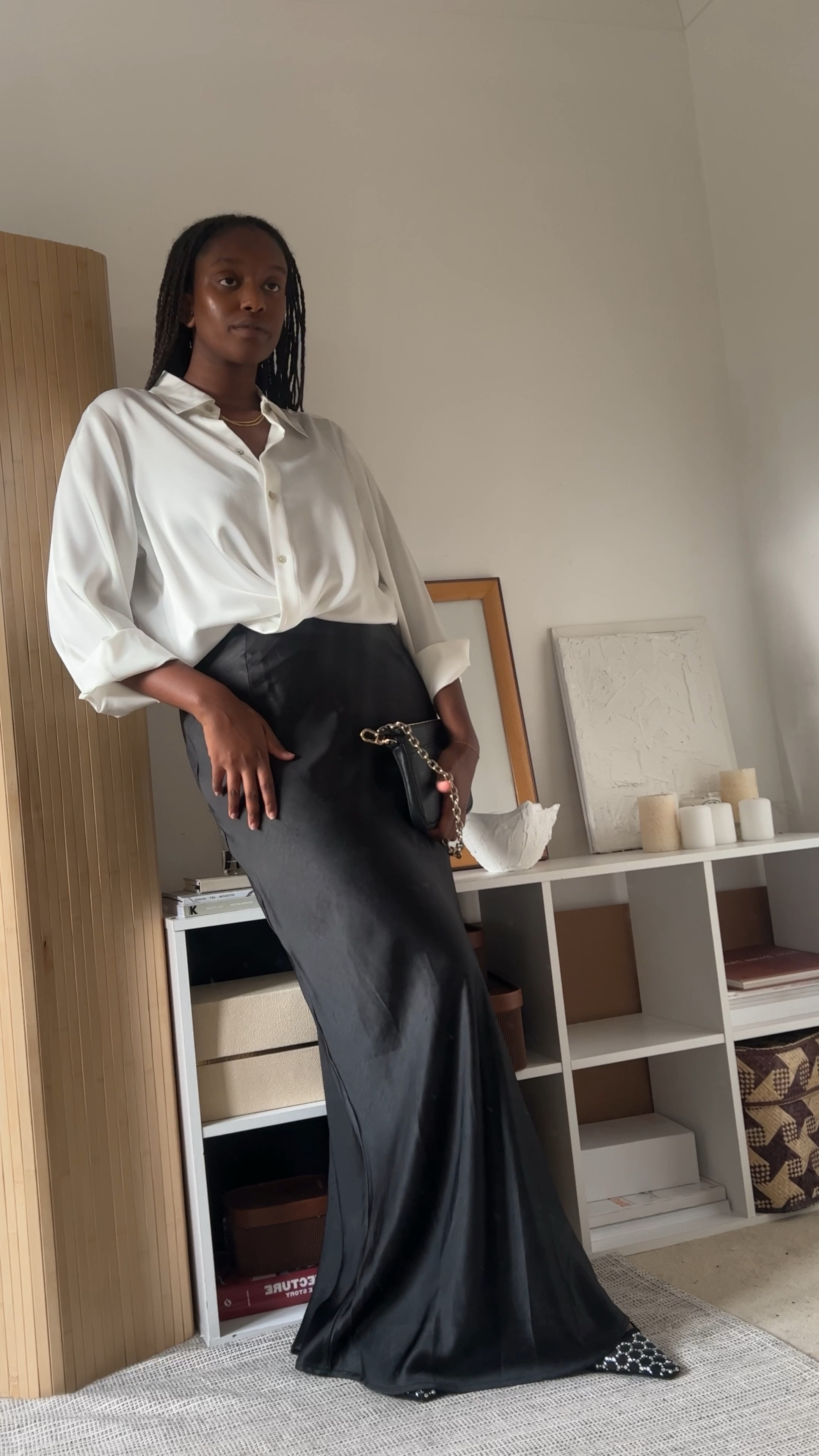 Minimal Evening and Christmas Party Outfit Inspired by Carolyn Bessette | Styling a black maxi satin skirt with a and white satin shirt with glitter heels for a simple but elevated dinner party look #maxiskirt #christmasoutfit #partyoutfit #satiskirt #dinneroutfit #eveningoutfit #newyearseveoitfit #glitterheels 

#LTKstyletip #LTKSeasonal #LTKHoliday