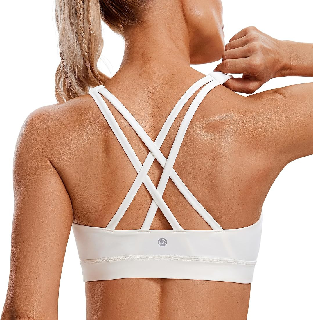 CRZ YOGA Women's Strappy Sports Bras Fitness Workout Padded Yoga Bra Criss Cross Back | Amazon (US)