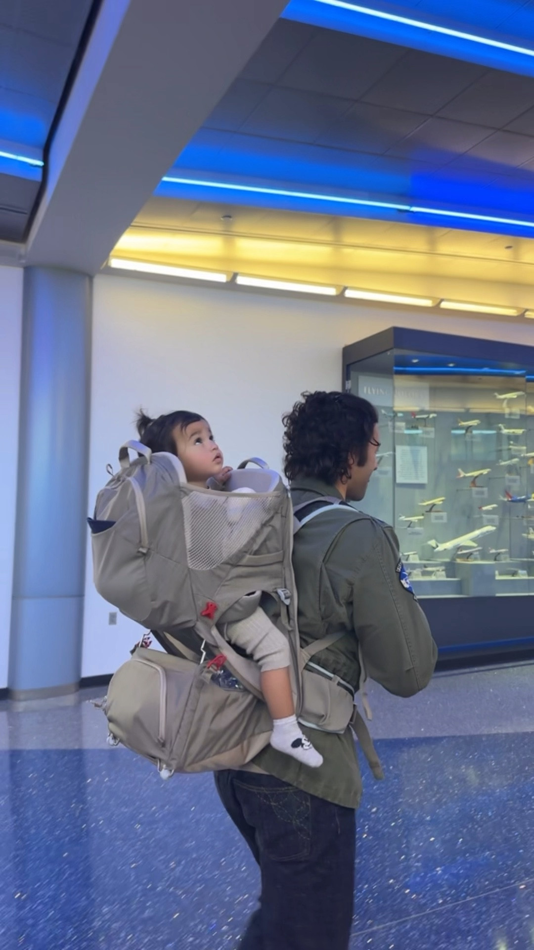 a hack for airport travel with a toddler!! we ditched the stroller and brought this child carrier which doubled as a diaper bag for us. Made things so much more convenient and comfortable for all of us highly recommend!! 

#LTKTravel #LTKBaby #LTKFamily