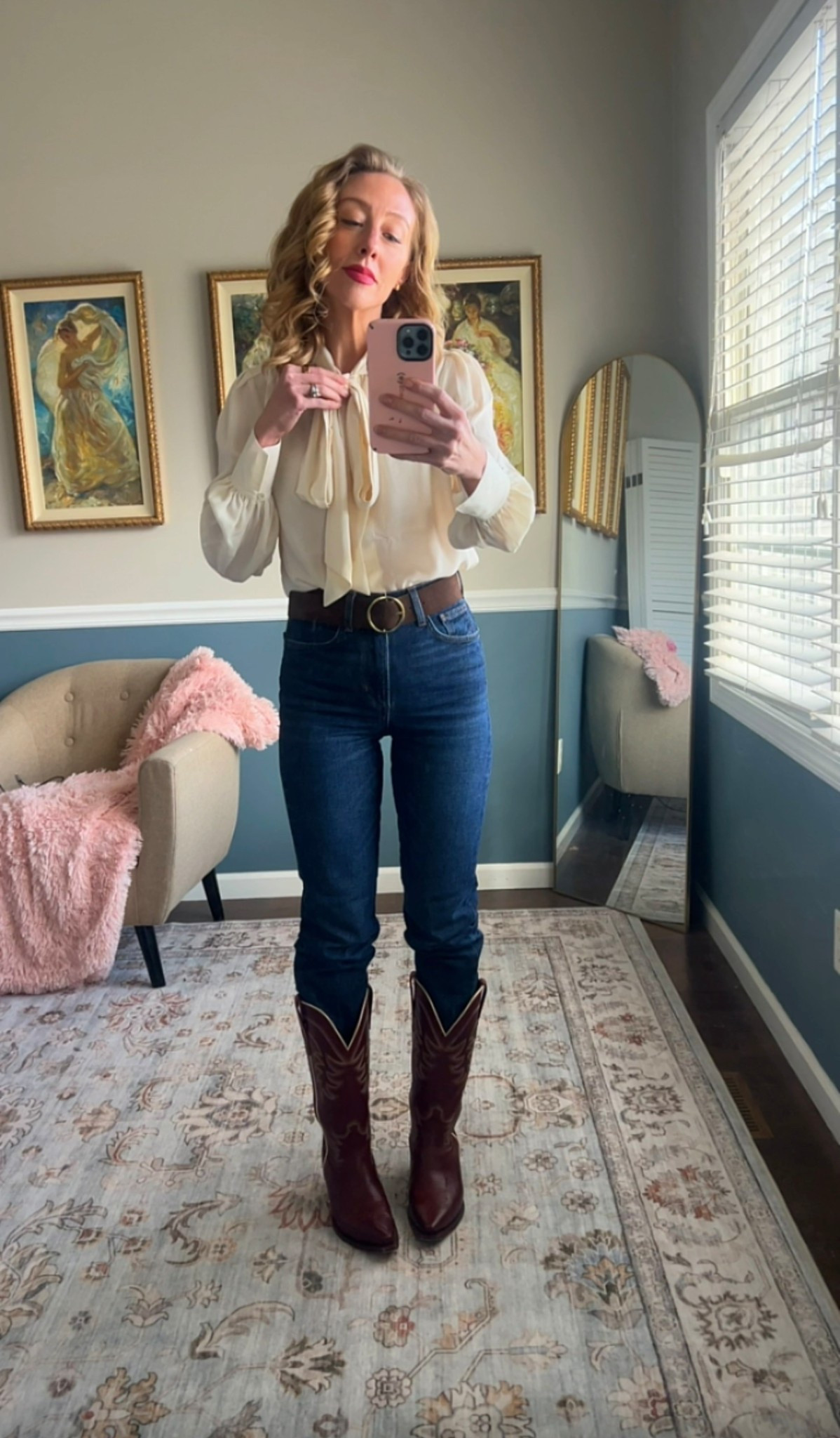 Cream tie-neck blouse styled with classic blue jeans, a brown leather belt, and burgundy cowboy boots.

A timeless American outfit formula with a Western-inspired touch.

Easy everyday look that works for fall, spring, or casual days out.


#LTKOver40 #LTKSeasonal #LTKootd