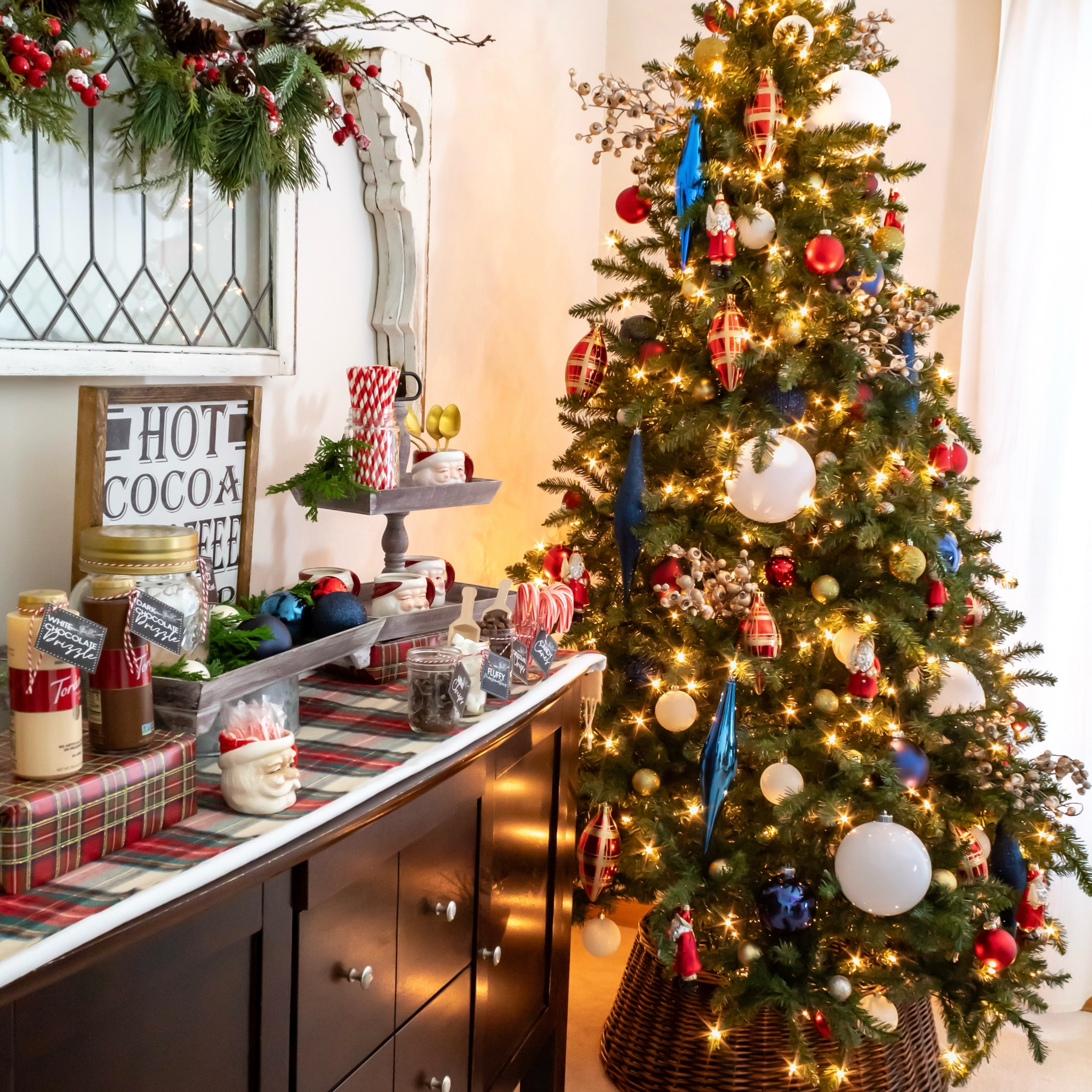 Red and blue decorations on a Christmas tree in the dining with a cozy hot cocoa bar 

#LTKHome #LTKHoliday #LTKSeasonal