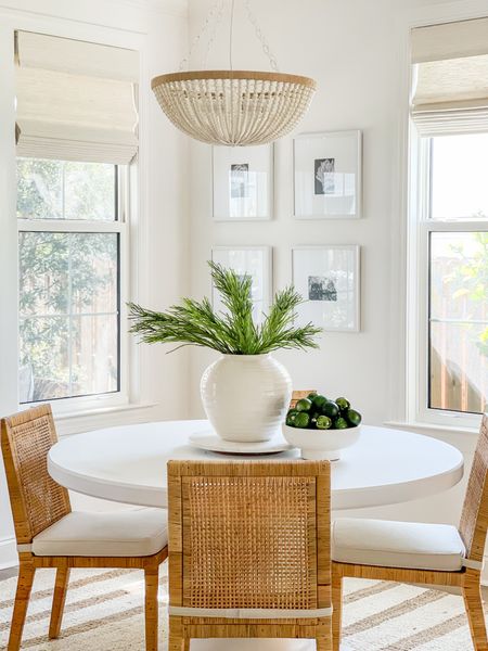 Loving how this gallery wall looks in our new dining room! This affordable set made a quick update with big impact! Perfect paired with our gorgeous rattan dining chairs and armchairs, striped jute rug, round white dining table, footed bowl filled with Christmas ornaments, and our bead chandelier!
.
#ltkhome #ltksalealert #ltkunder50 #ltkunder100 #ltkstyletip #ltkholiday #ltkseasonal #ltkgiftguide

#LTKsalealert #LTKhome #LTKHoliday
