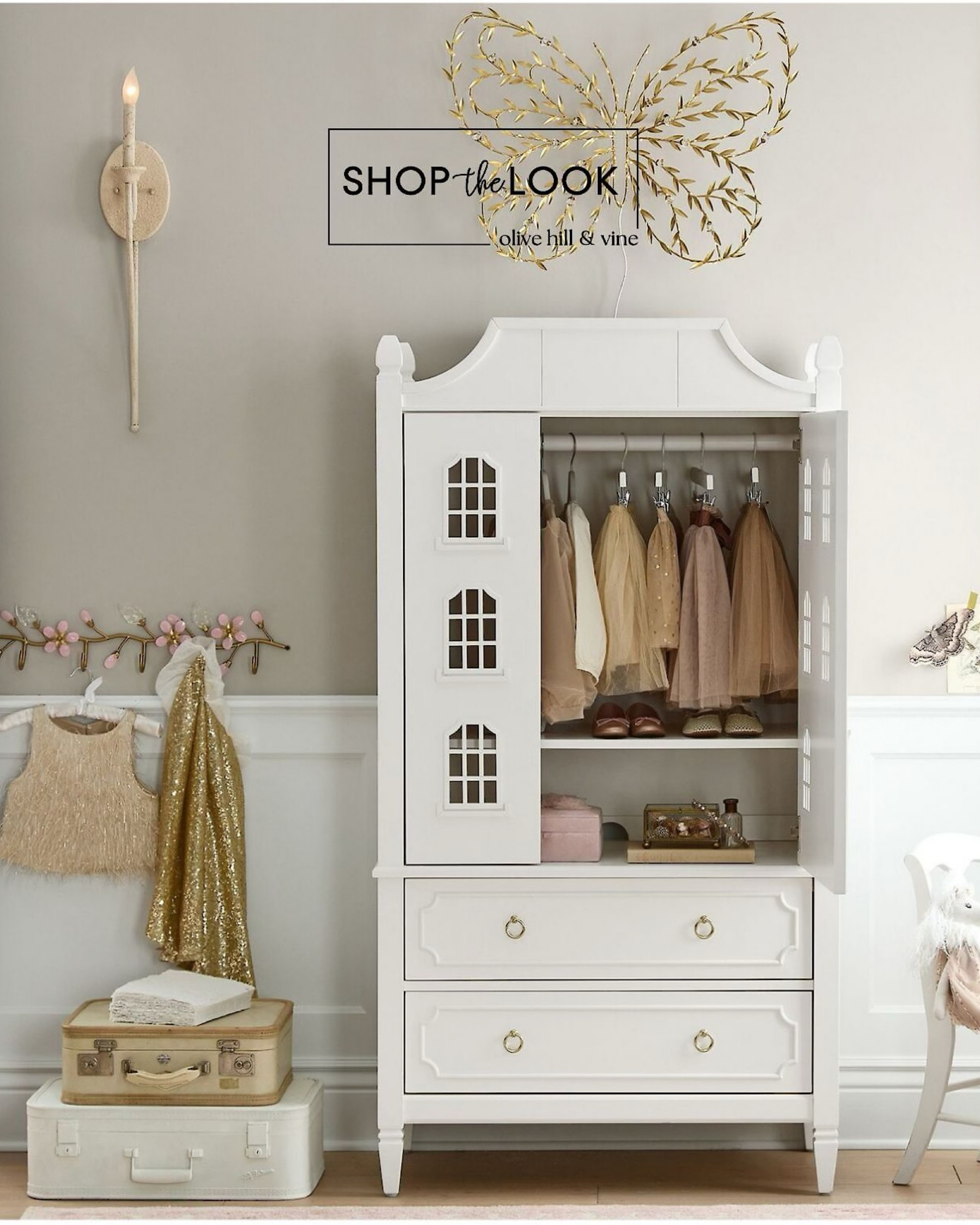 Bring a touch of Hollywood glam into your child's room with this Ava Regency Dollhouse Armoire. With elegant details like scalloped paneling and golden hardware, it's a star-quality storage solution. Complete the look with a Monique Lhuillier light-up butterfly and a floral vine wall rack with hooks—shop these luxe pieces now! 

#LTKKids #LTKFamily #LTKHome