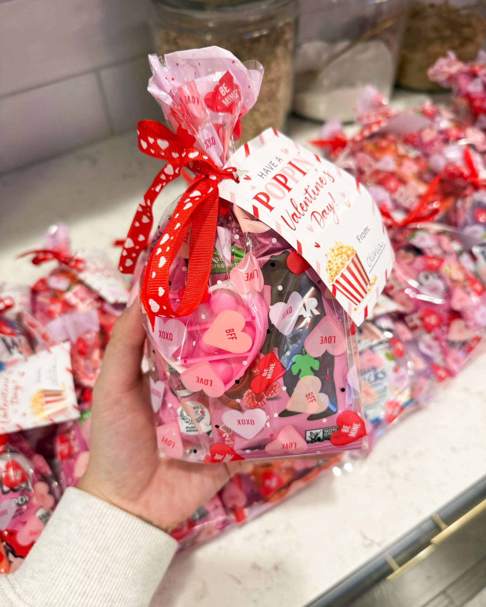 Valentine’s class gifts in mini cello bags! 

Clear bags, ribbons, valentine’s day gift tags, popcorn, party favors, plastic kazoos, pop its, fidget toys, shredded paper for gift 

#LTKValentine #LTKHome #LTKKids
