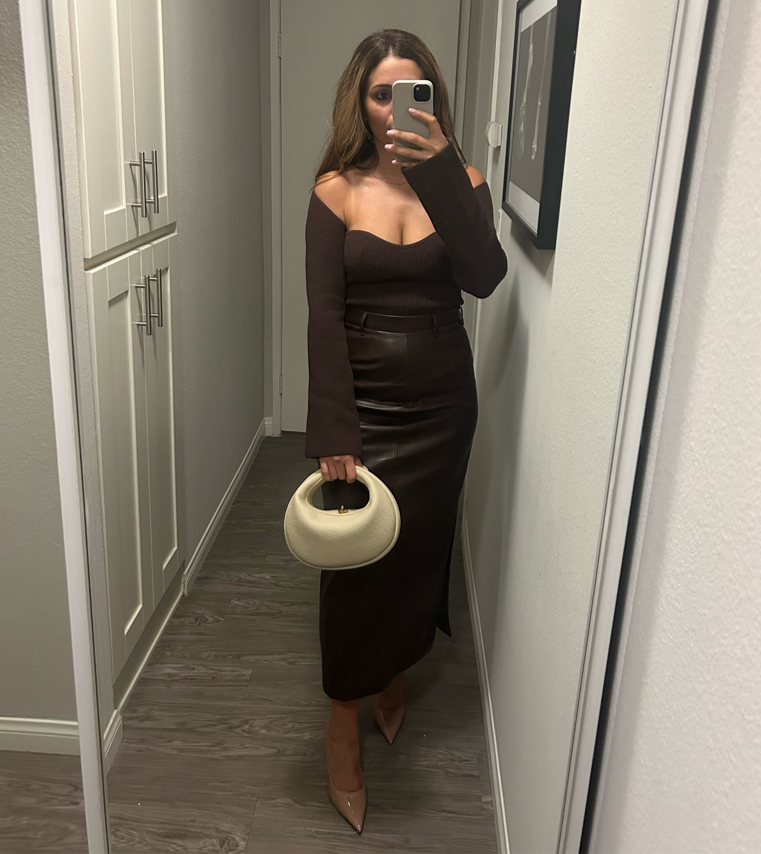 Chocolate brown leather skirt with sweetheart neck sweater. Pair it with the Songmont Luna bag and nude heels. I’m wearing Jimmy Choo patent leather Love 100 nude pumps  

#leatherskirt

#LTKsalealert #LTKparties #LTKstyletip