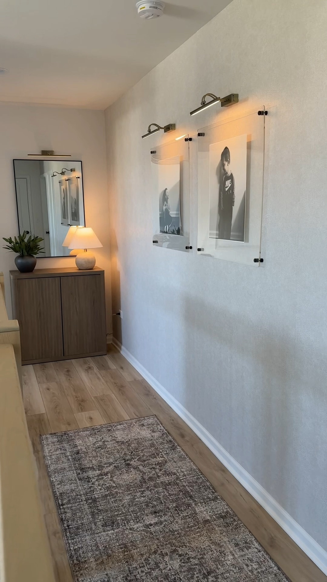 A quick hallway transformation that’s both elevated and functional! 
Mirror size - 28x26 (picture light above is 20 inch size)
Clear frames (24inchx24inch) picture light above is 13 inch size) - 16x20 poster prints inside 
Hallway runner - 2-7x8 size 

#LTKHome #LTKSaleAlert