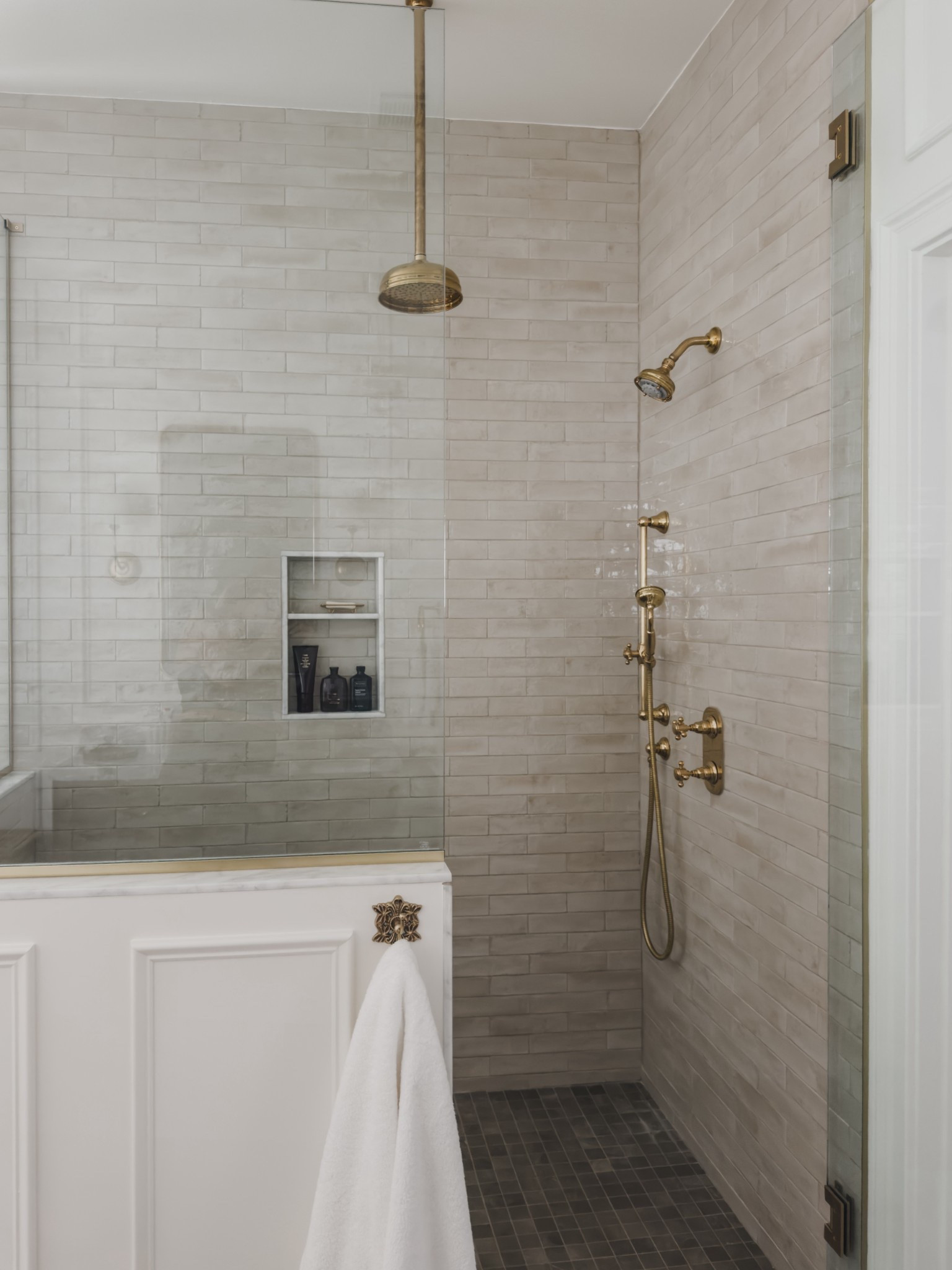 Primary bathroom shower details! When designing this space I knew I wanted to comtinue the unlacquered brass detail that I love so much! Combined with the classic pattern of a subway tile in a neutral tone with a niche and shower bench for functionality.

Home finds, neutral home inspo, primary bathroom refresh, timeless bathroom inspo, shower wall detail, unlacquered brass, bathroom hardware detail, towel hook, Wayfair, Anthropologie, Oribe, wainscoting detail, shop the look!

#LTKSeasonal #LTKHome