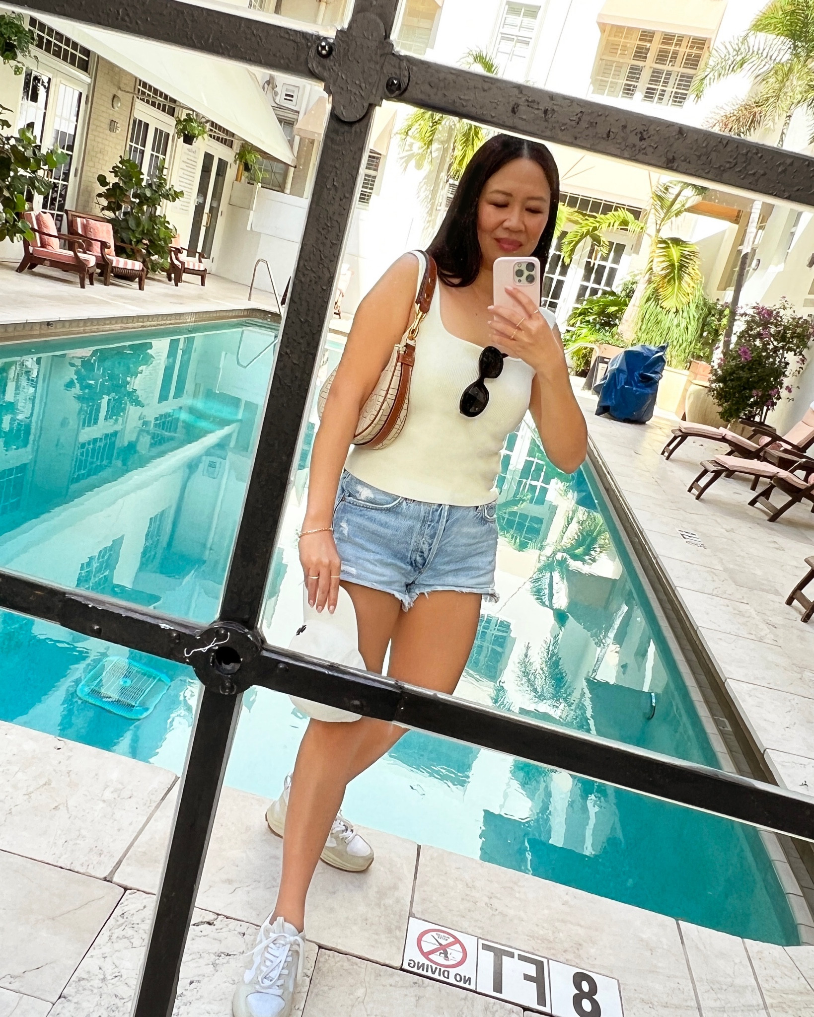 Reformation Tank (wearing a Medium for a 34c), Agolde Parker Shorts (Size 26) and Veja Venturi Sneakers (wearing size 36, my usual sneaker size is 36.5 or 37)