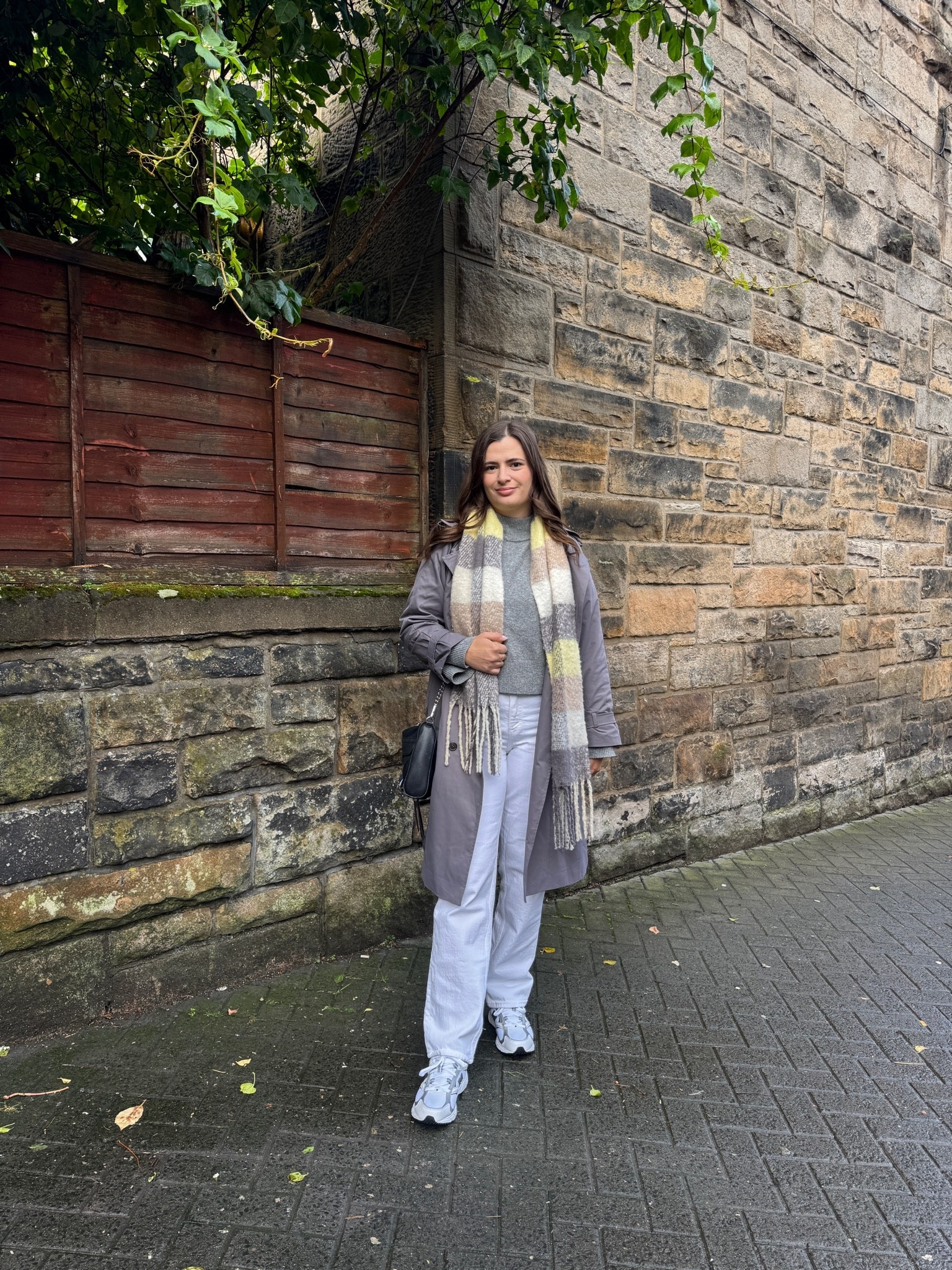 Edinburgh Scotland fall outfit idea! The gray trench is perfect for the overcast weather this time of year layered over a gray sweater and white jeans.

#LTKootd #LTKSeasonal