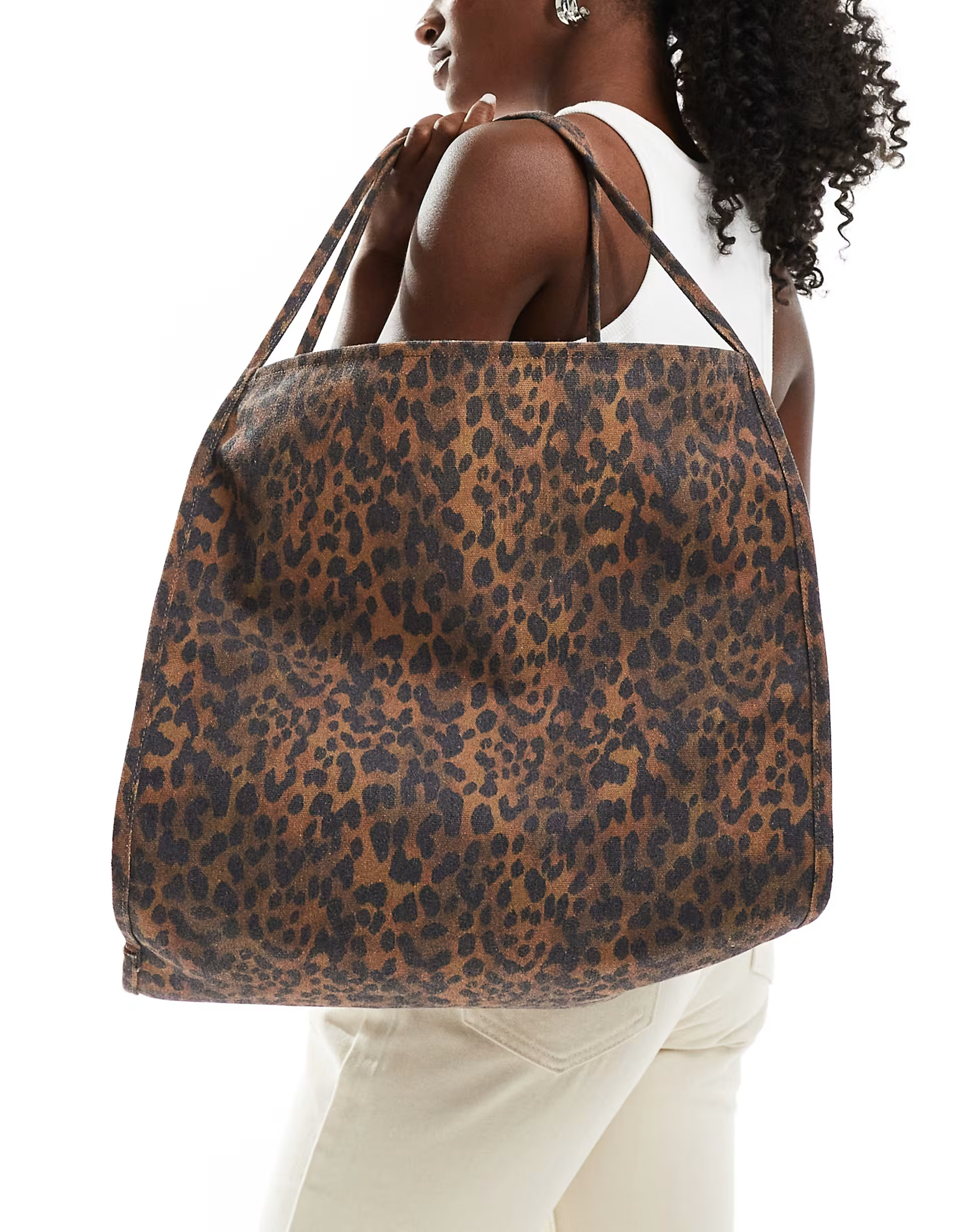 ASOS DESIGN tubular handle canvas tote bag in brown leopard | ASOS | ASOS (Global)