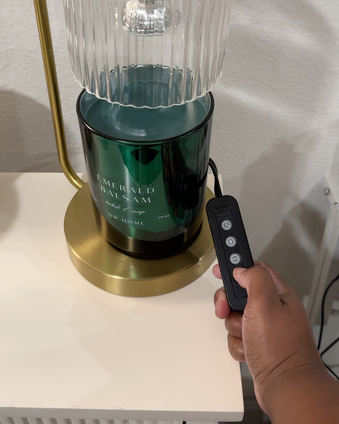 Candle warmer that doubles as decor. Adjustable light, remote control, and melts evenly without an open flame. Cozy, luxe, and perfect for setting the mood. DO NOT underestimate these — the scent throw is phenomenal. 💯

#LTKHome #LTKFindsUnder50