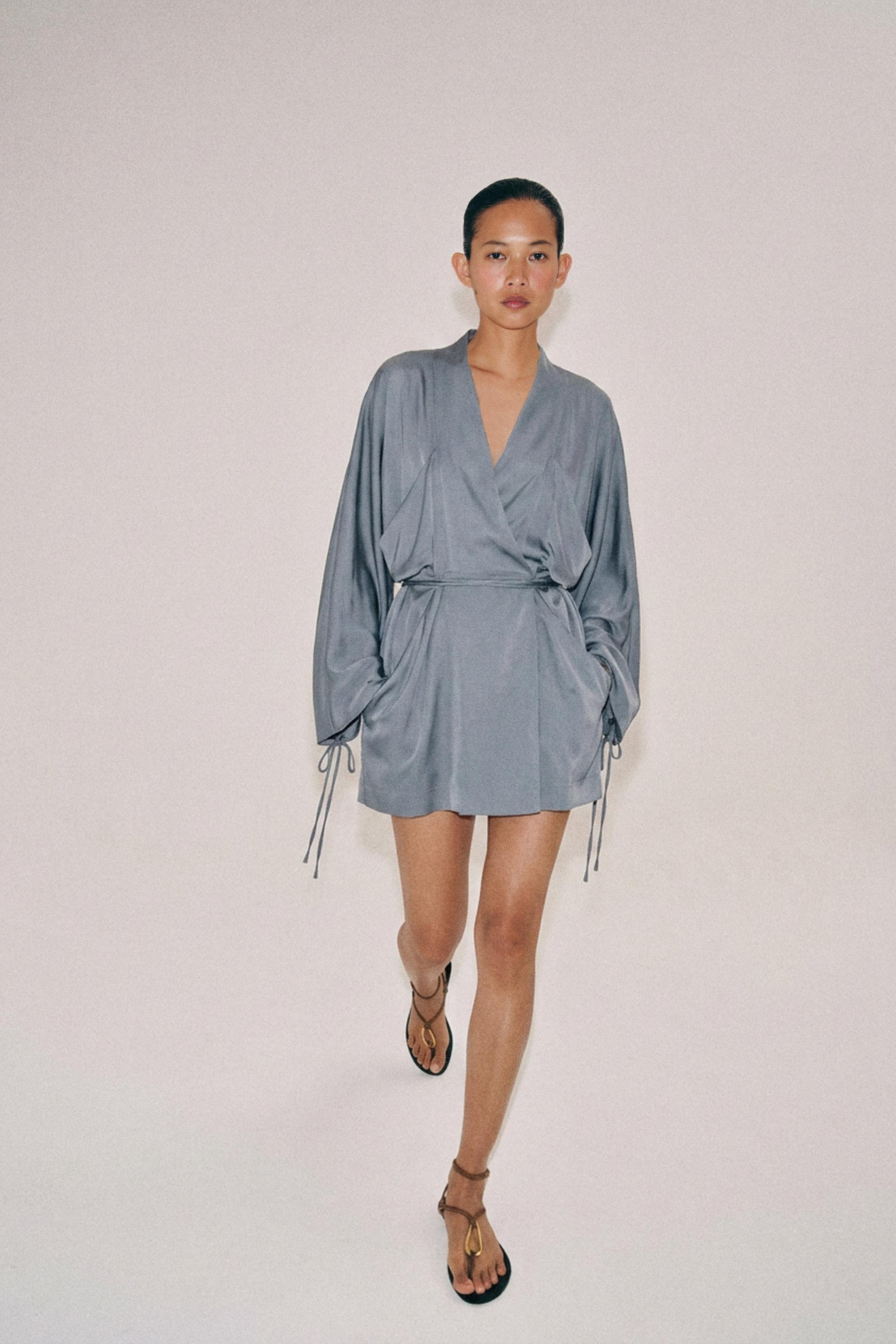 ZARA WOMAN COLLECTIONShort dress made with lyocell yarn. V-neckline and long sleeves with tie det... | Zara US