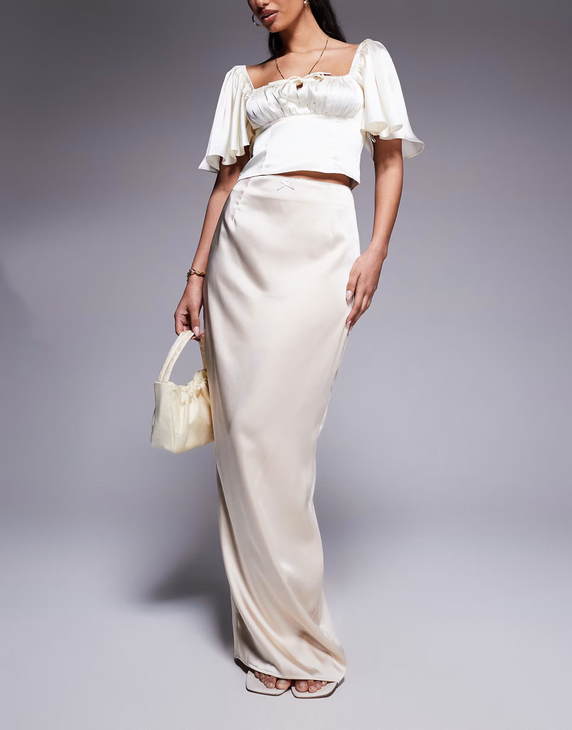 Kaiia exclusive satin bodycon bow trim detail maxi skirt in cream | ASOS (Global)